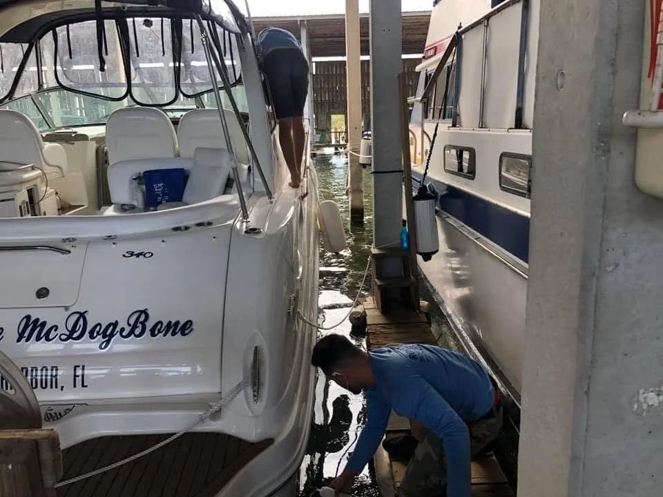 Boat exterior being professionally waxed