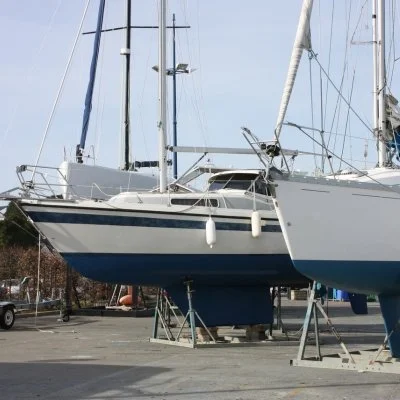 Boat on stands receiving full detailing and exterior cleaning