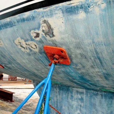 Boat hull being cleaned to remove oxidation and restore gelcoat