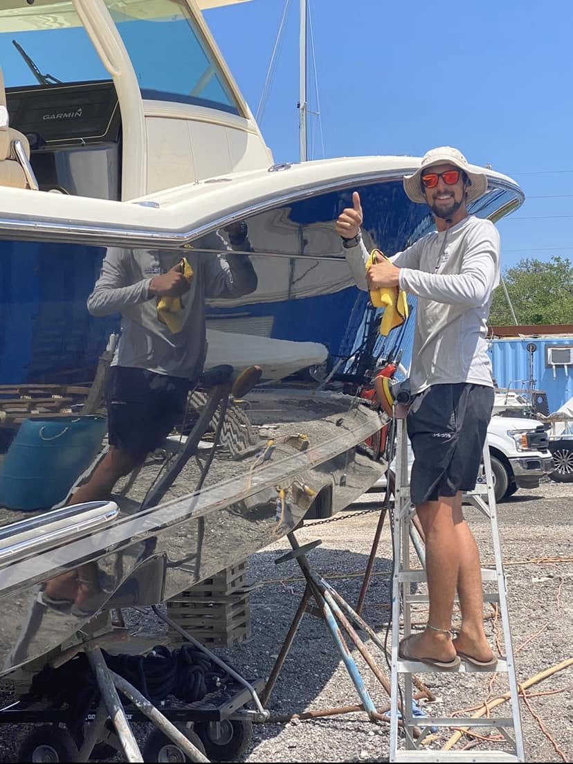 Professional boat detailing technician at work