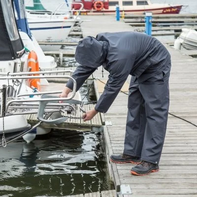 Boat detailer polishing stainless steel hardware