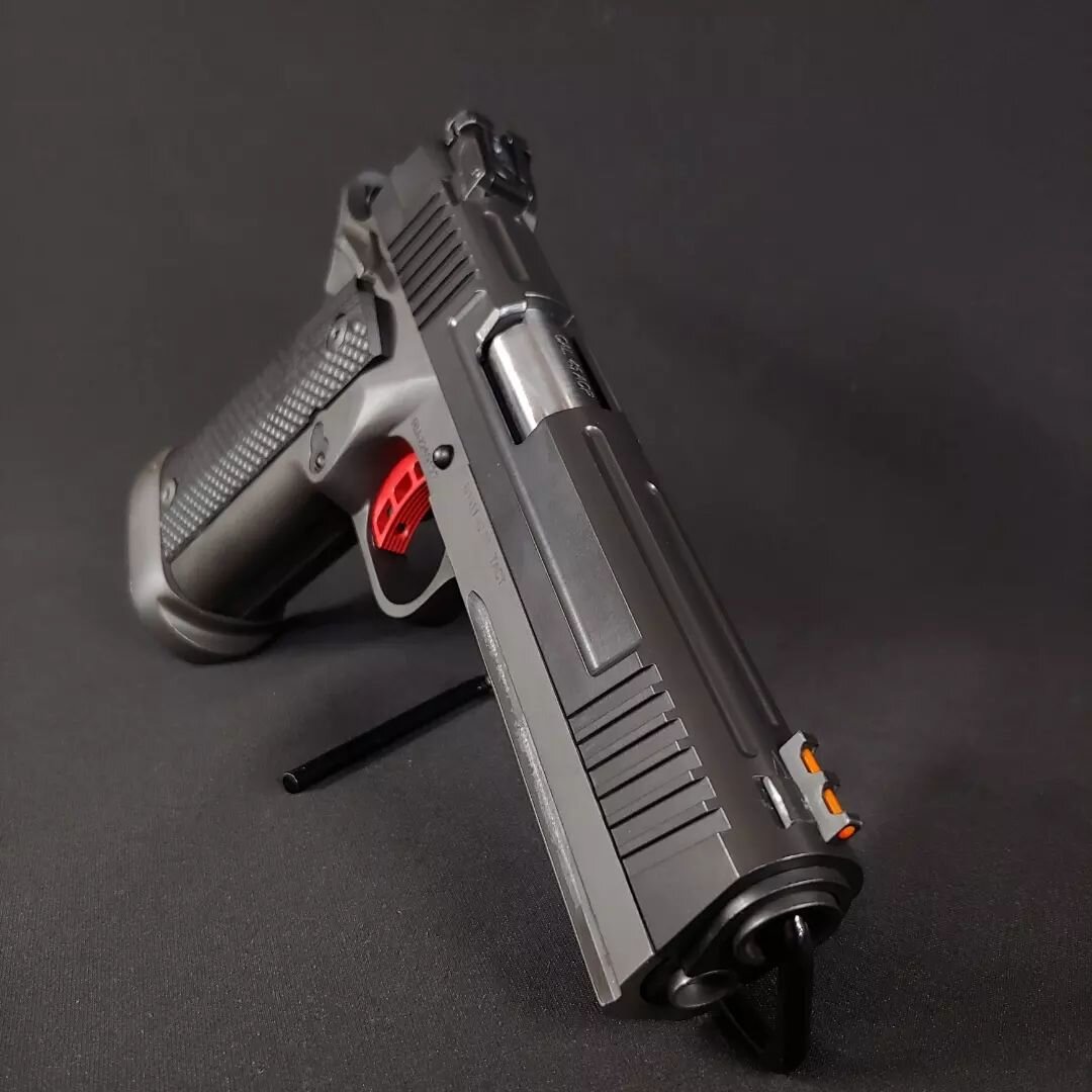 We've been pretty behind on posting our projects this year, so it's time to catch up. This Rock Island Armory TAC Ultra came through the shop a while back for some lightening and smoothing. To cut weight, we milled lightening panels and flutes into t