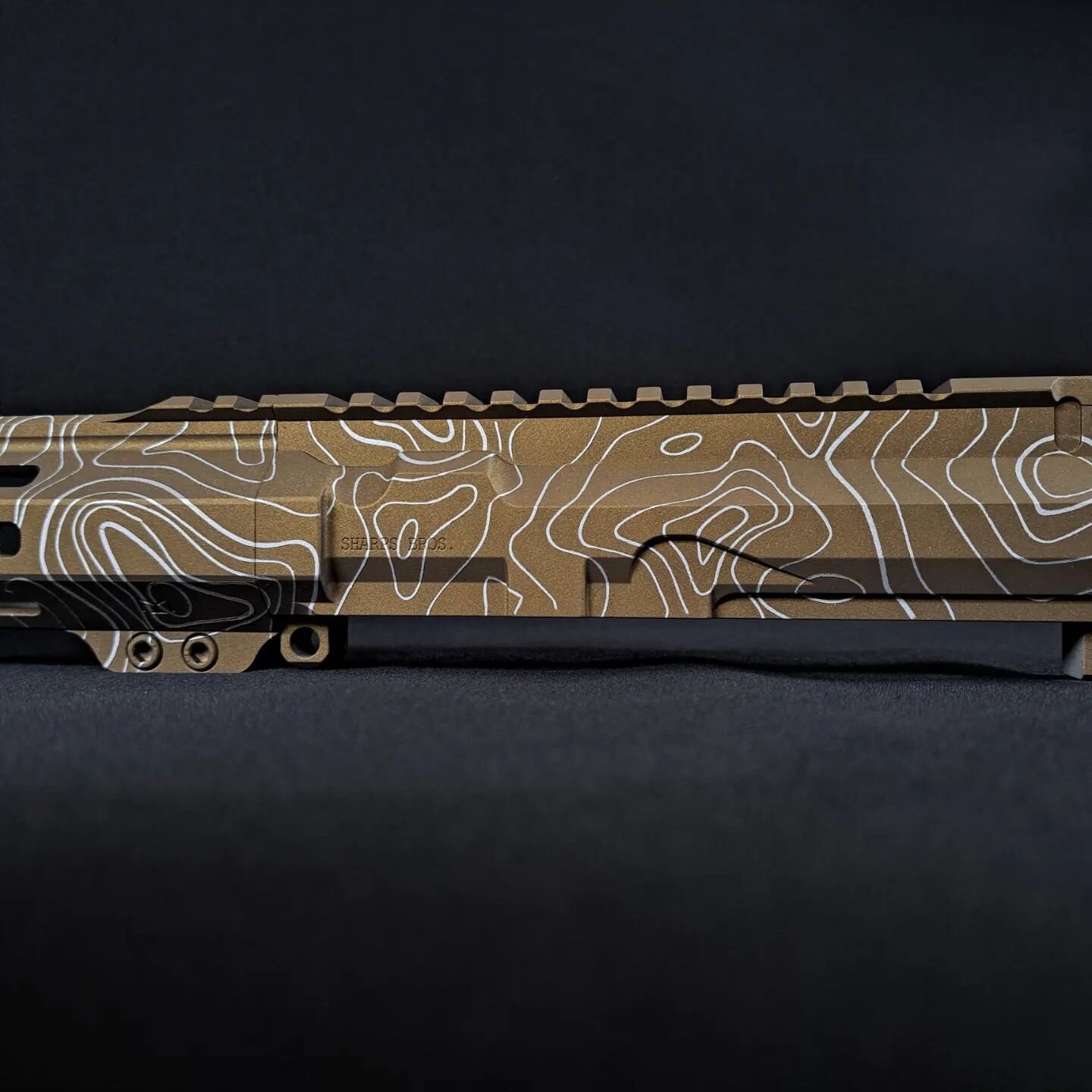A little Satin Aluminum and Burnt Bronze Topographic Pattern to kick off the month? Projects like this one are the reason we love Cerakote so much. As an added feature, before coating we opened up the ejection port with our mill so it can reliably ej