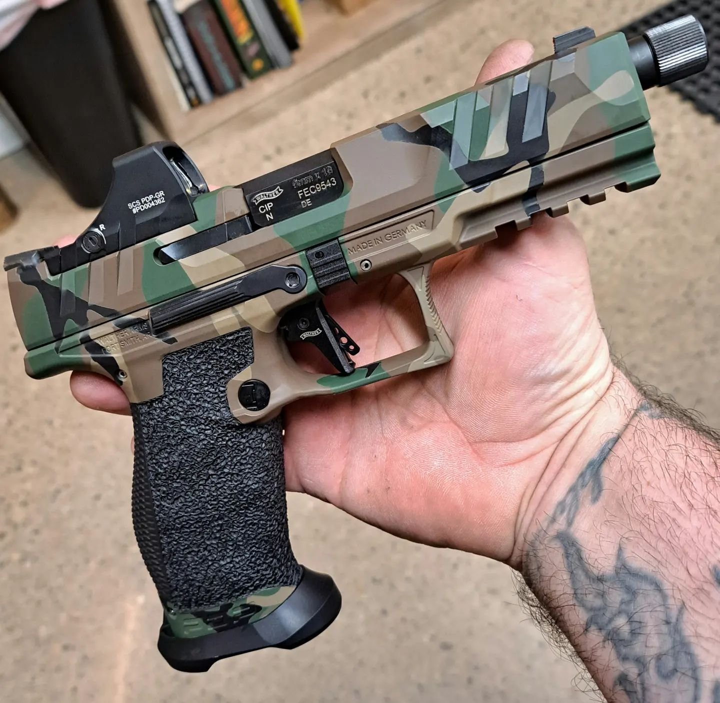 Does it make anyone else feel old when we hear people refer to M81 Woodland as a &quot;retro&quot; camouflage? We dressed up this @waltherarms PDP with a @holosunoptics SCS optic, brass backstrap, full-coverage stippling, and that sweet M81 @cerakote