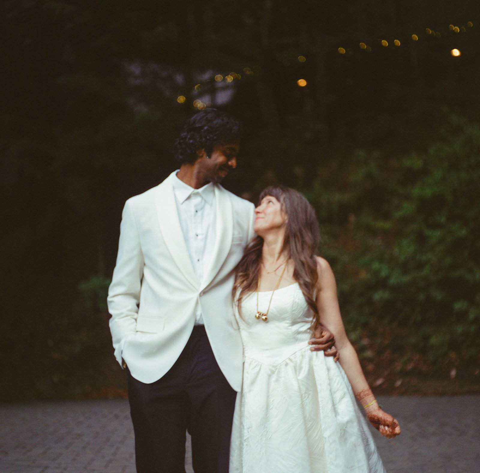 newlyweds celebrating beneath redwoods Waterfall Lodge ceremony