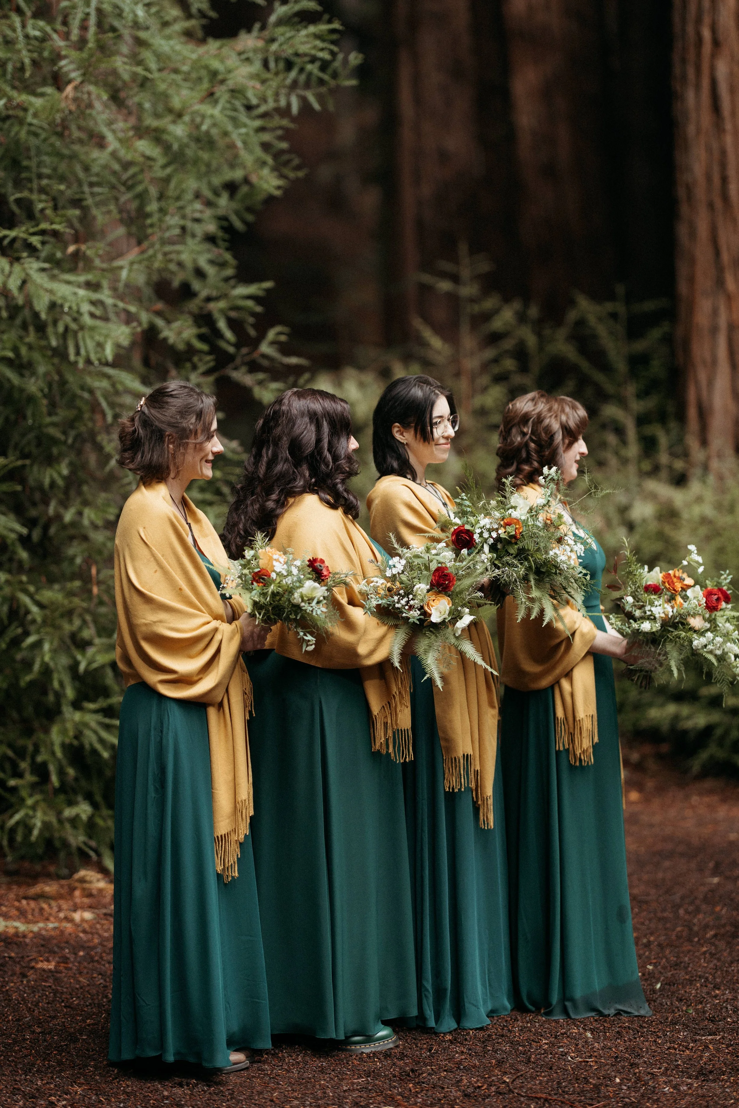 wedding ceremony beneath towering redwoods Waterfall Lodge Retreat