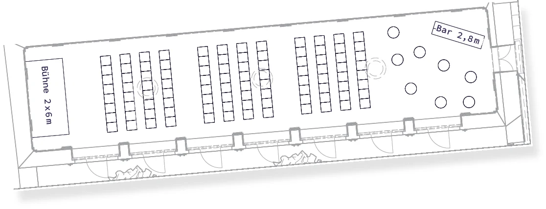 Konferenz Setting im ViENNABALLHAUS mit Sesselreihen und Bar-Bereich