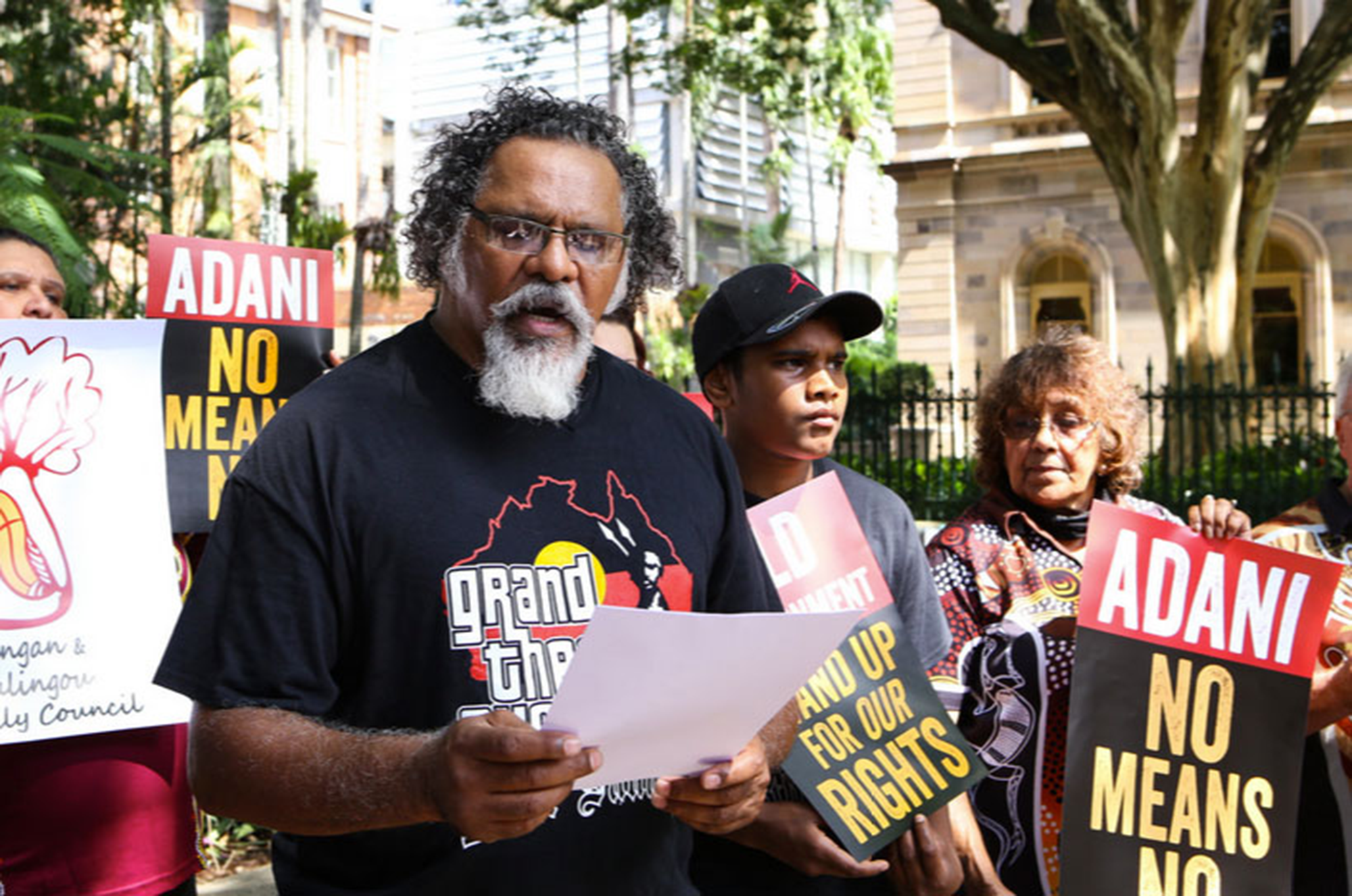 Adrian Burragabba, representing the Wangan and Jagalingou people, addressing a crowd
