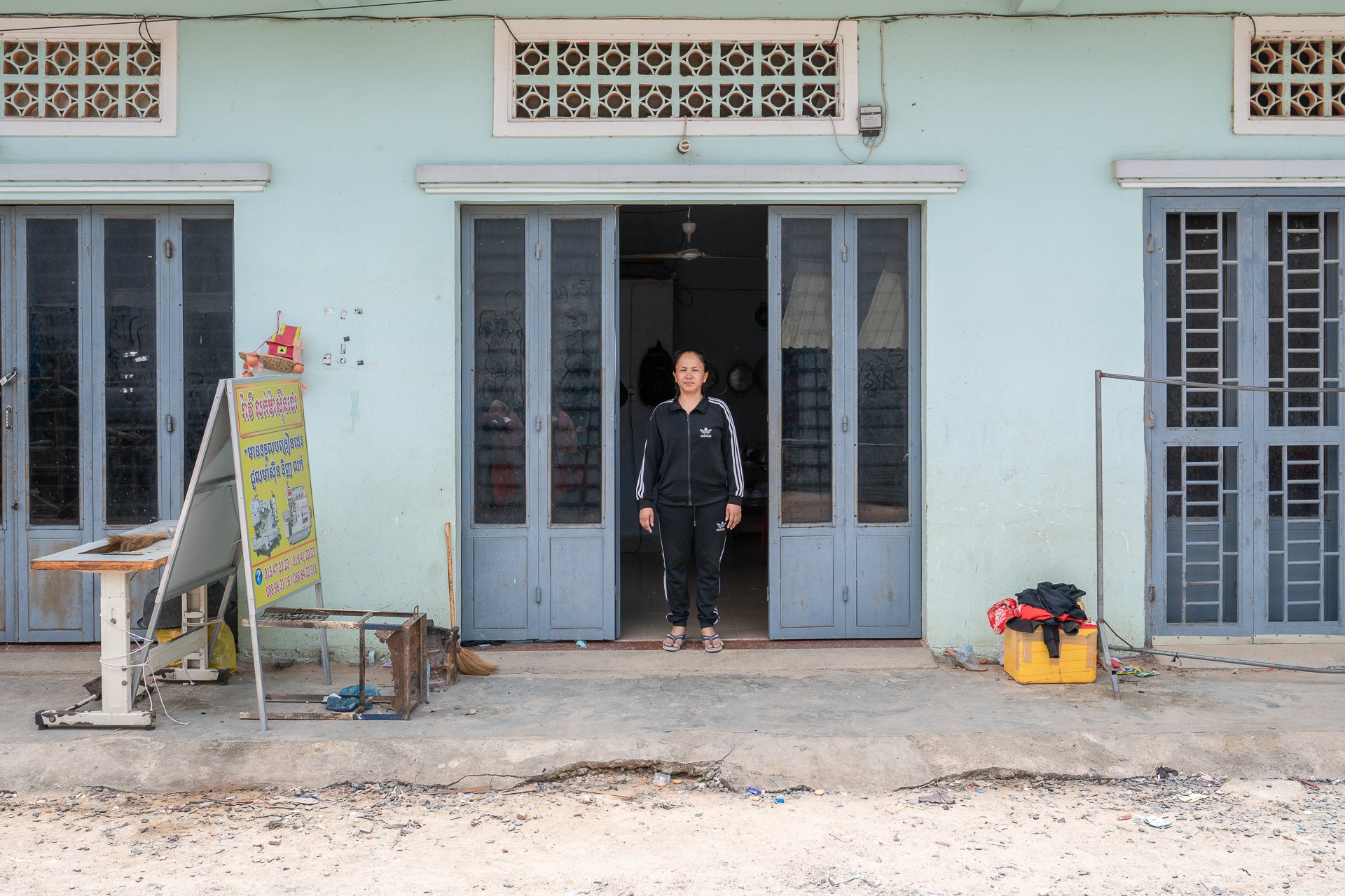 Sok Voeun stood in her metal doorway