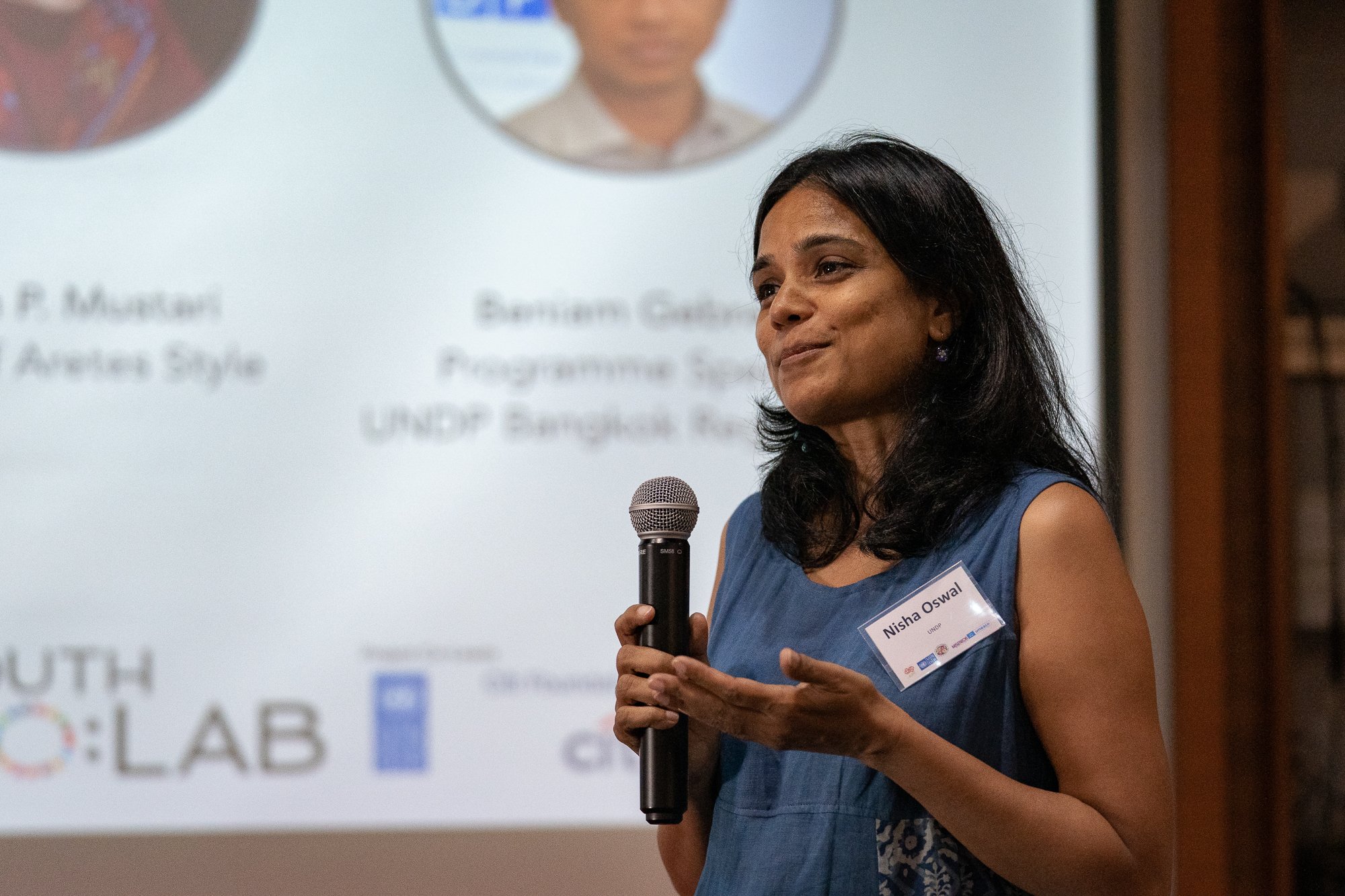 A female participant presents at the CO:LAB conference
