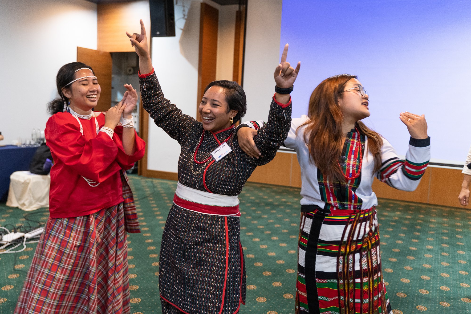 A female YECAP participant celebrates after winning an icebreaker challenge