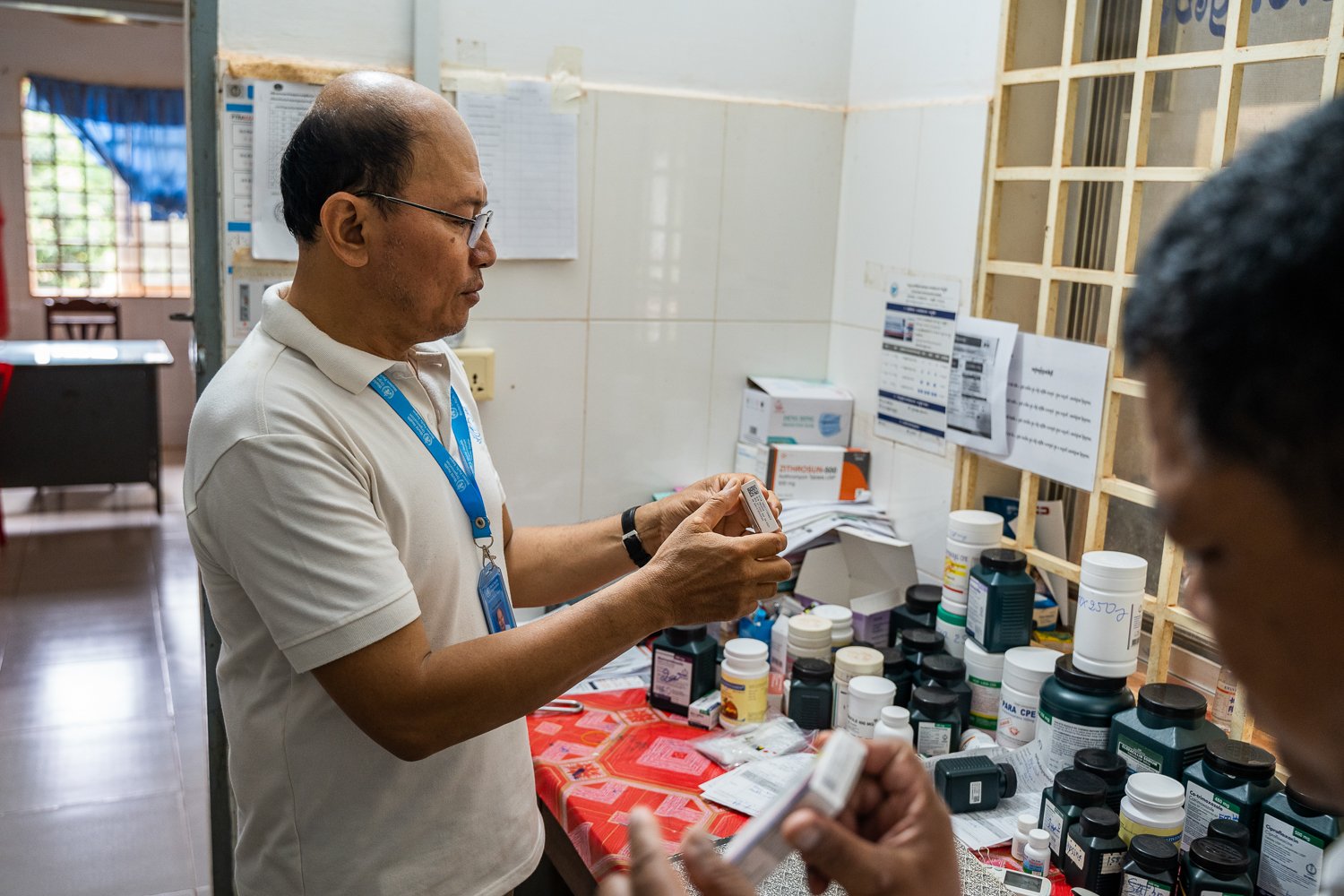 Sophal does a stock take of malaria prevention medicine at Siem Pang Health Center