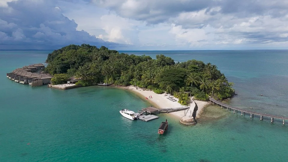Aerial view of the beach, jetty and boats at Song Saa Private Island in the Koh Rong Archipelago, Cambodia