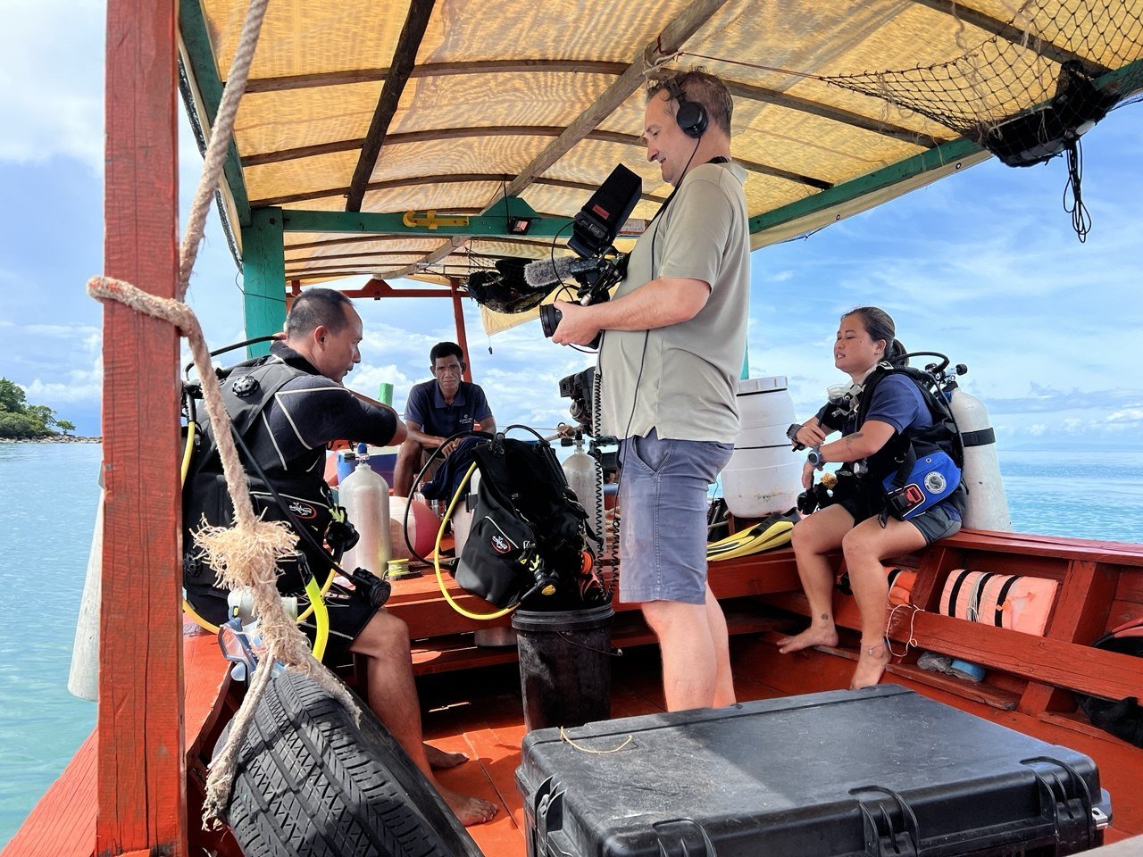 George Jefferies filming the Song Saa Foundation dive team preparing to dive from a boat in the Koh Rong Archipelago, Cambodia