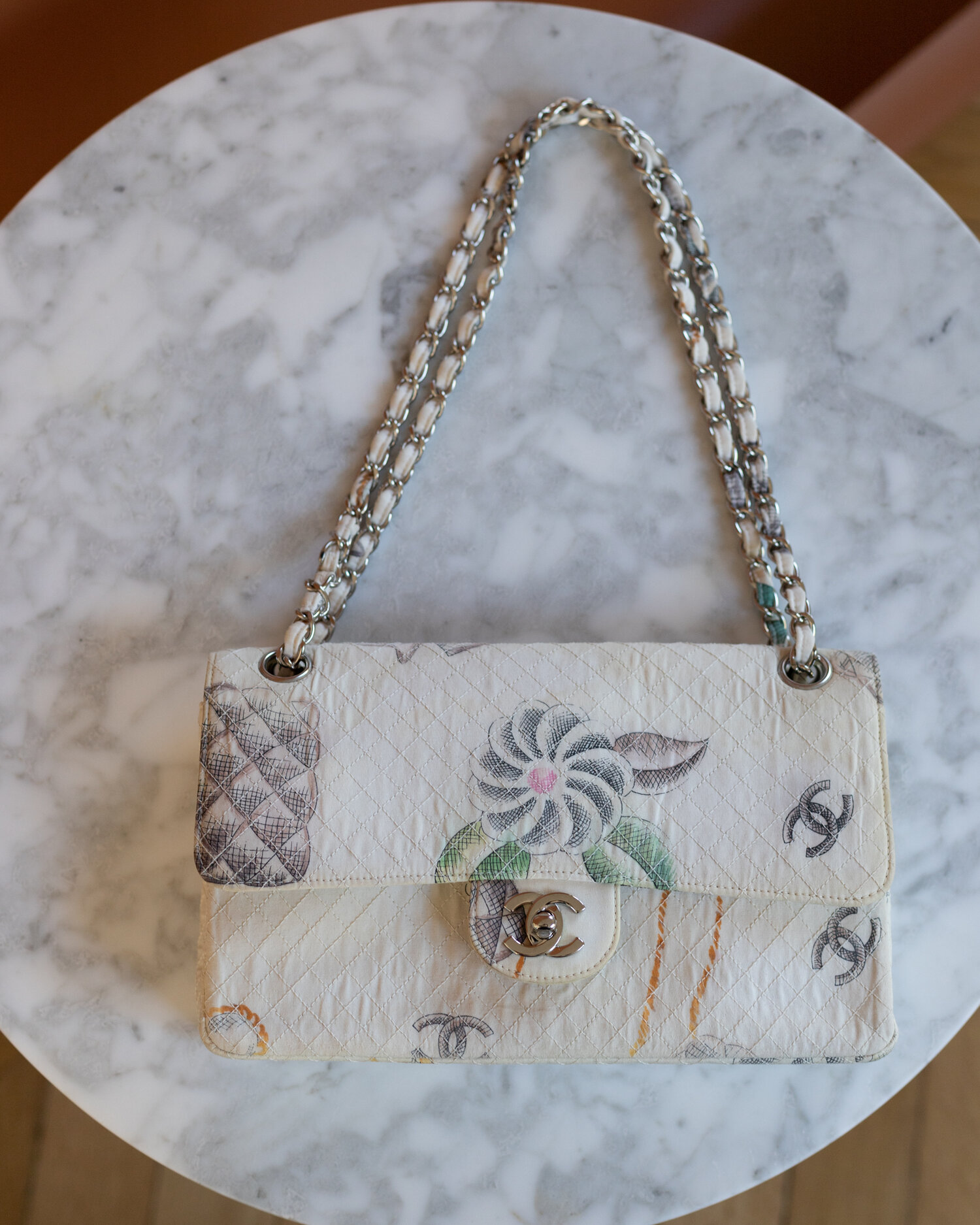 chanel white purse with the chanel flower