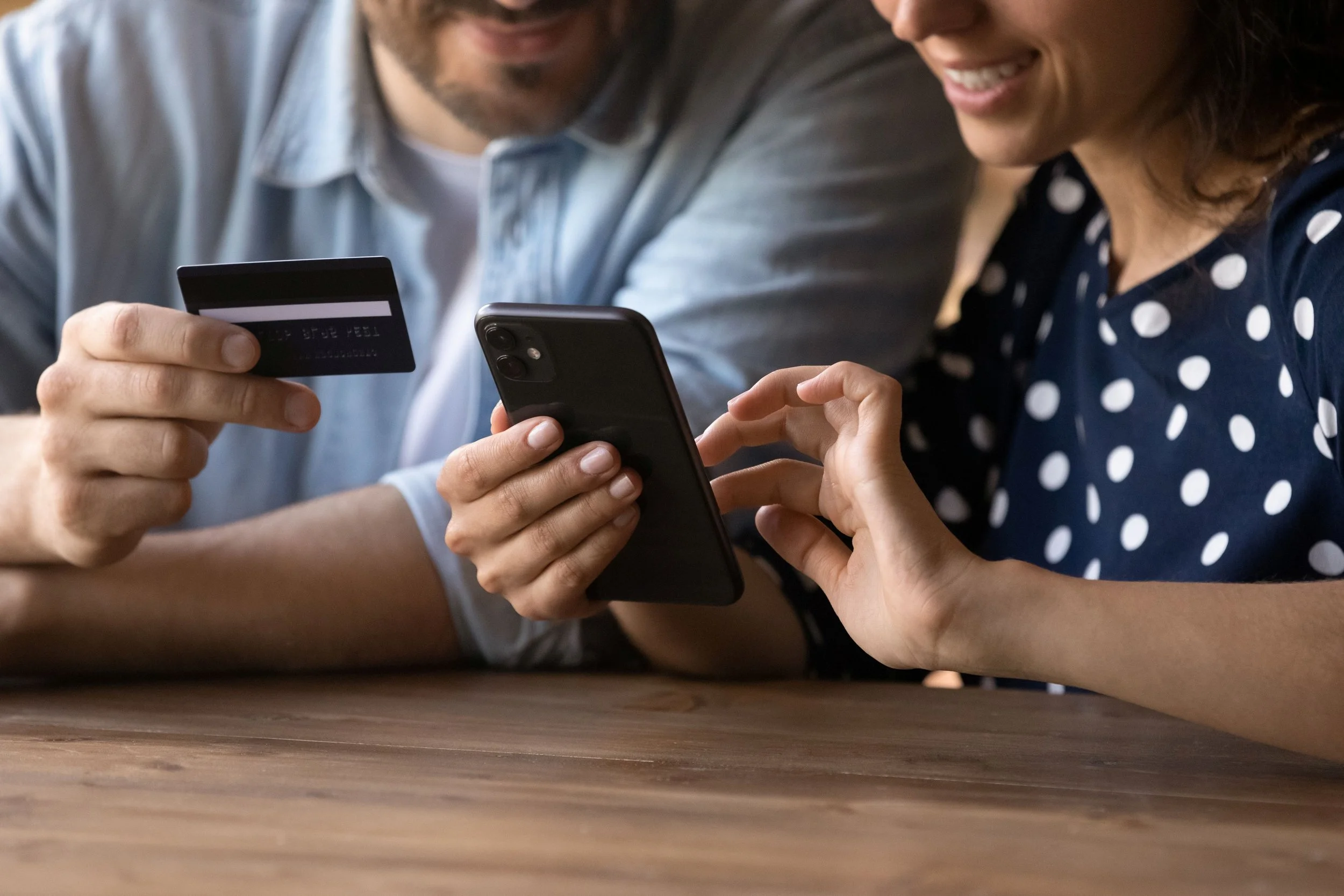 couple paying with phone.jpg
