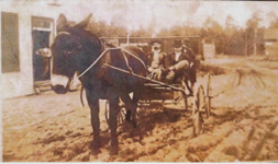 Dolly Stallings, from the Archives of William Bexley Boykin. Taken in the 1920’s on Main Street with a railroad car in the background.