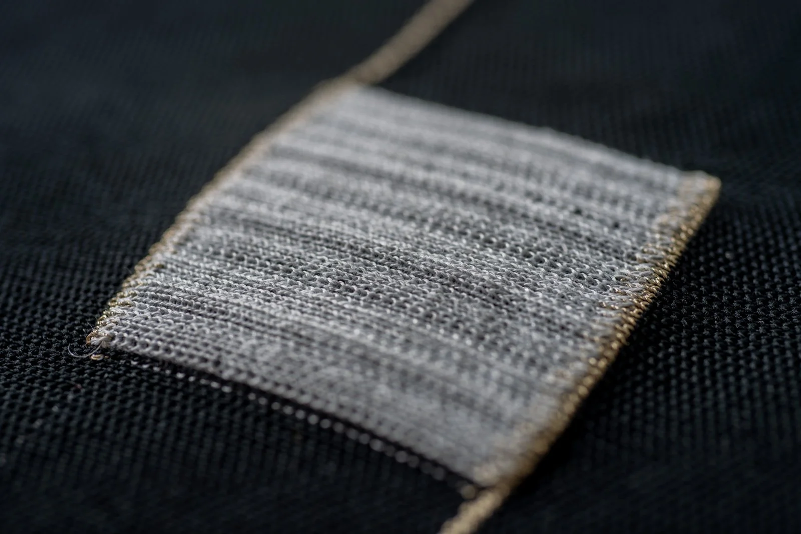 Close-up of a knitted sensor using conductive yarn.