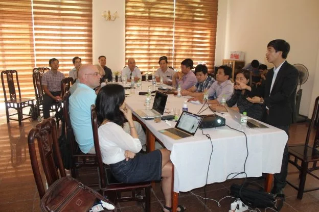 Mr. Hao discusses the trace code implementation with meeting participants