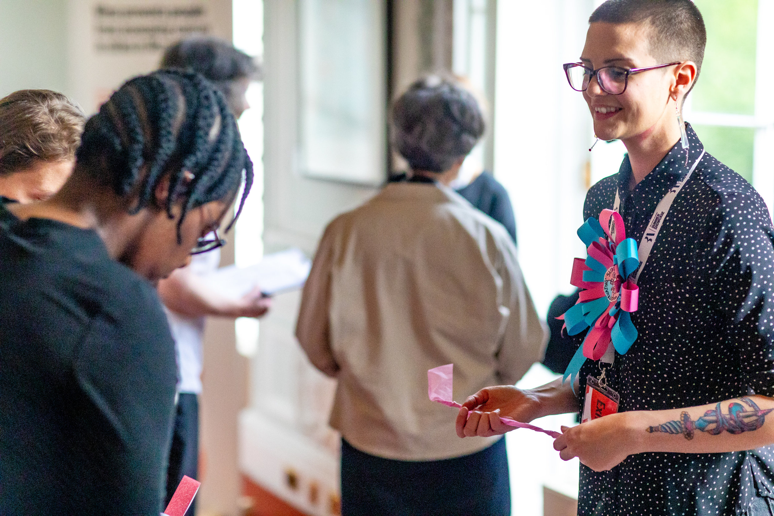 Bee Hughes talks to a visitor at the British Academy
