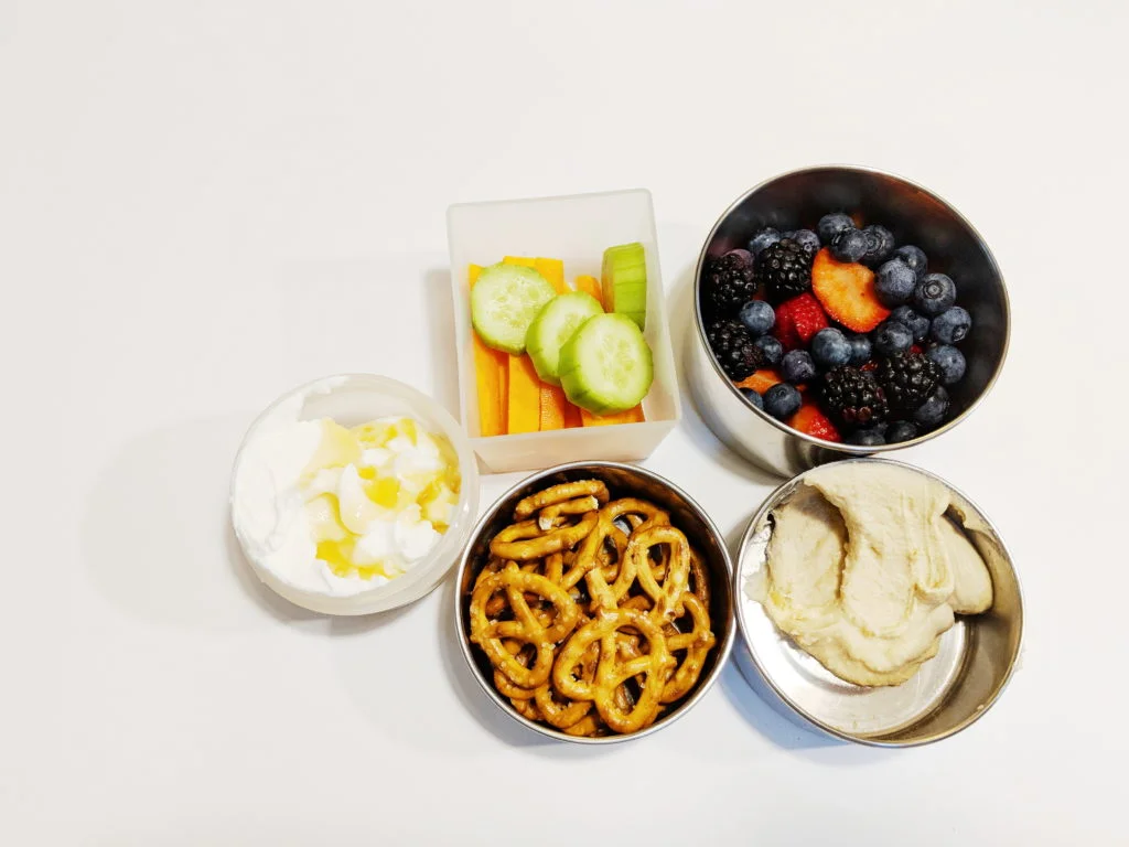 Hummus; pretzels; greek yogurt with honey; veggies & berries.