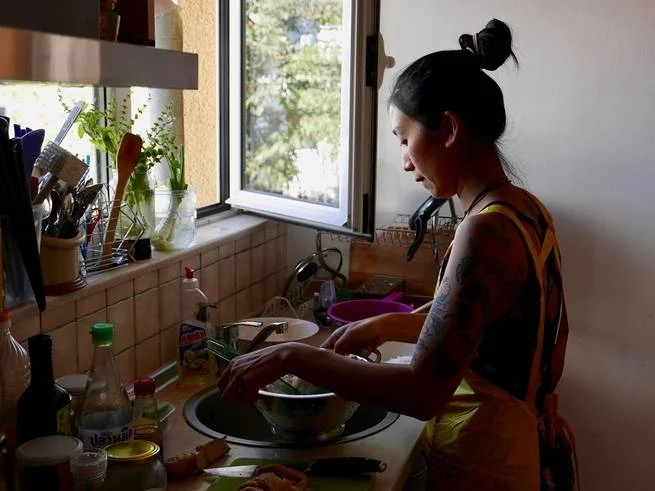 Kim Kim Dao makes Pho Ga for customers in her small apartment in Sofia, Bulgaria.