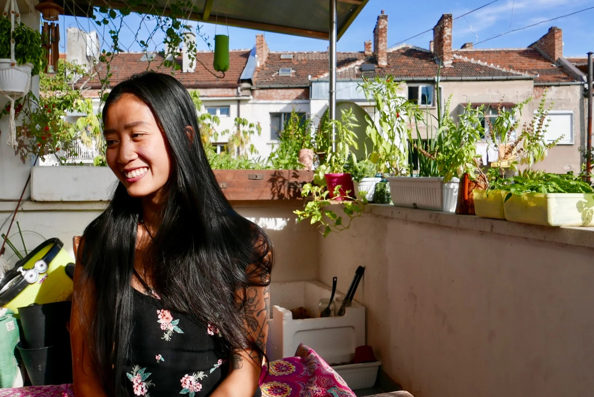 Kim Kim Dao makes the most of her small porch, growing many of the exotic herbs needed for her recipes.
