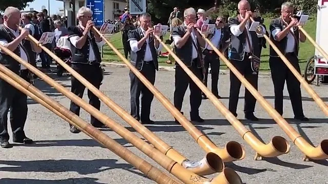 Musicians play the traditional alphorn during the festival.