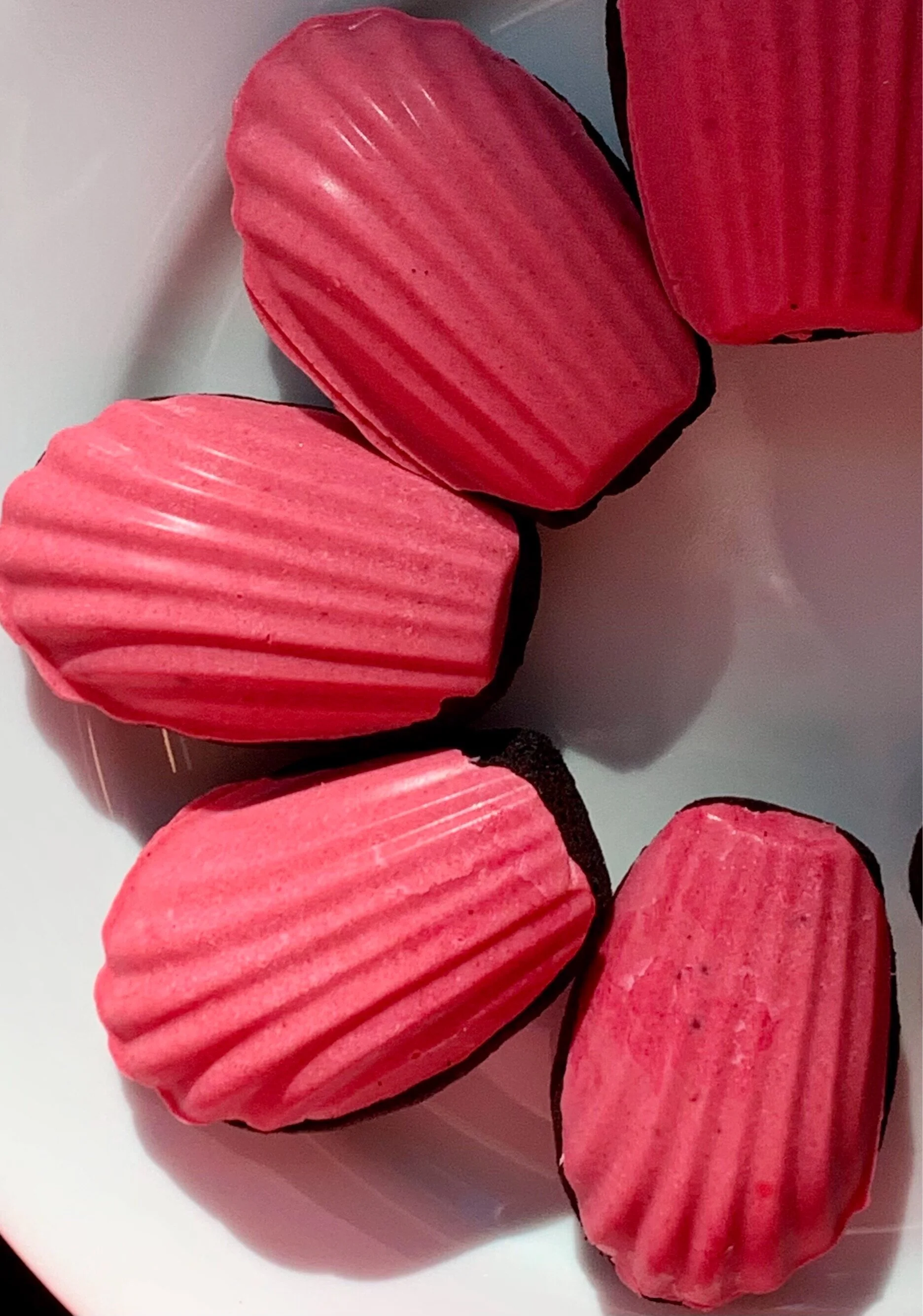 Dark Chocolate Madeleines with Raspberry-White Chocolate Icing