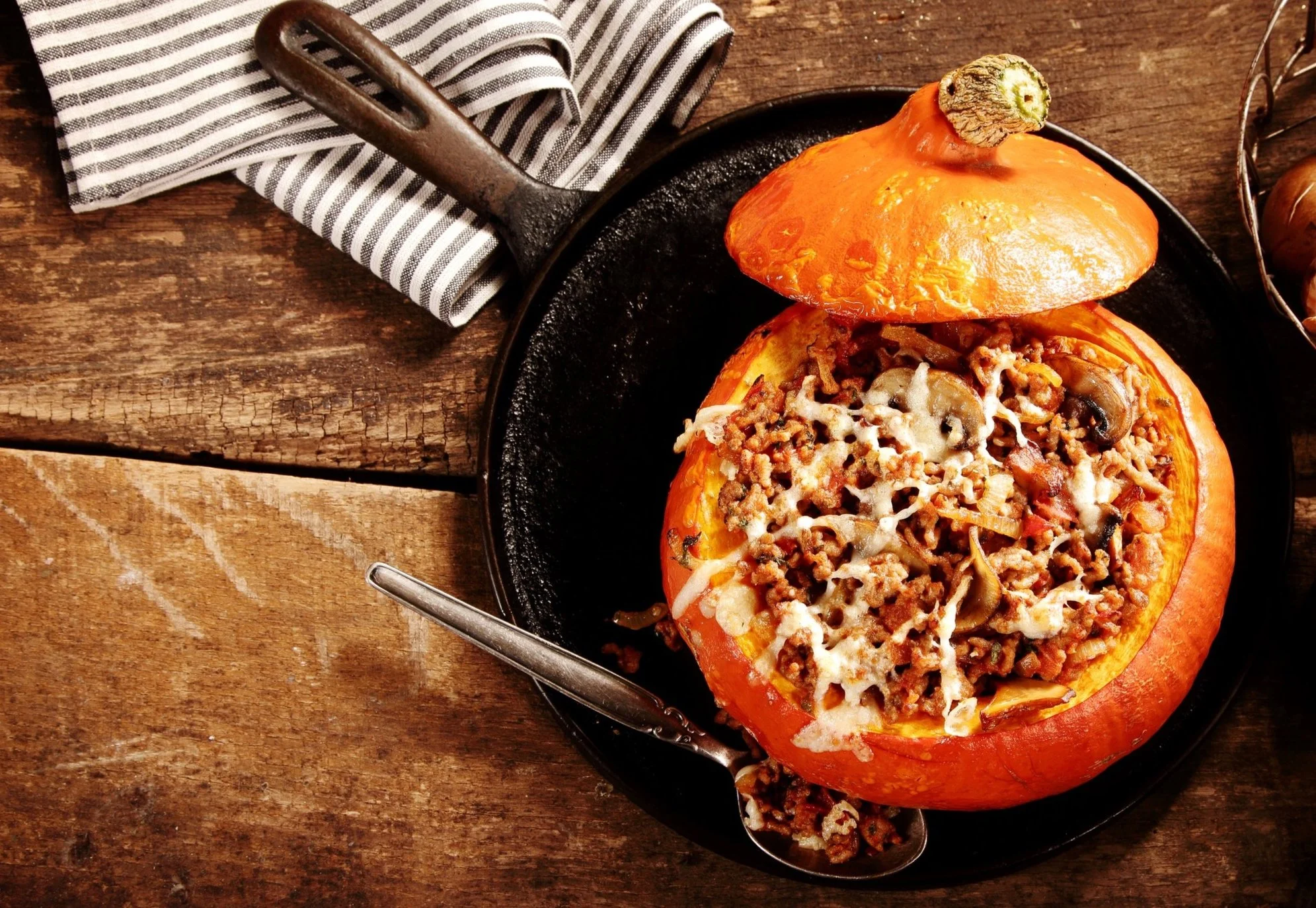 Roasted Pumpkin Stuffed With Sausage, Apples and Gruyére