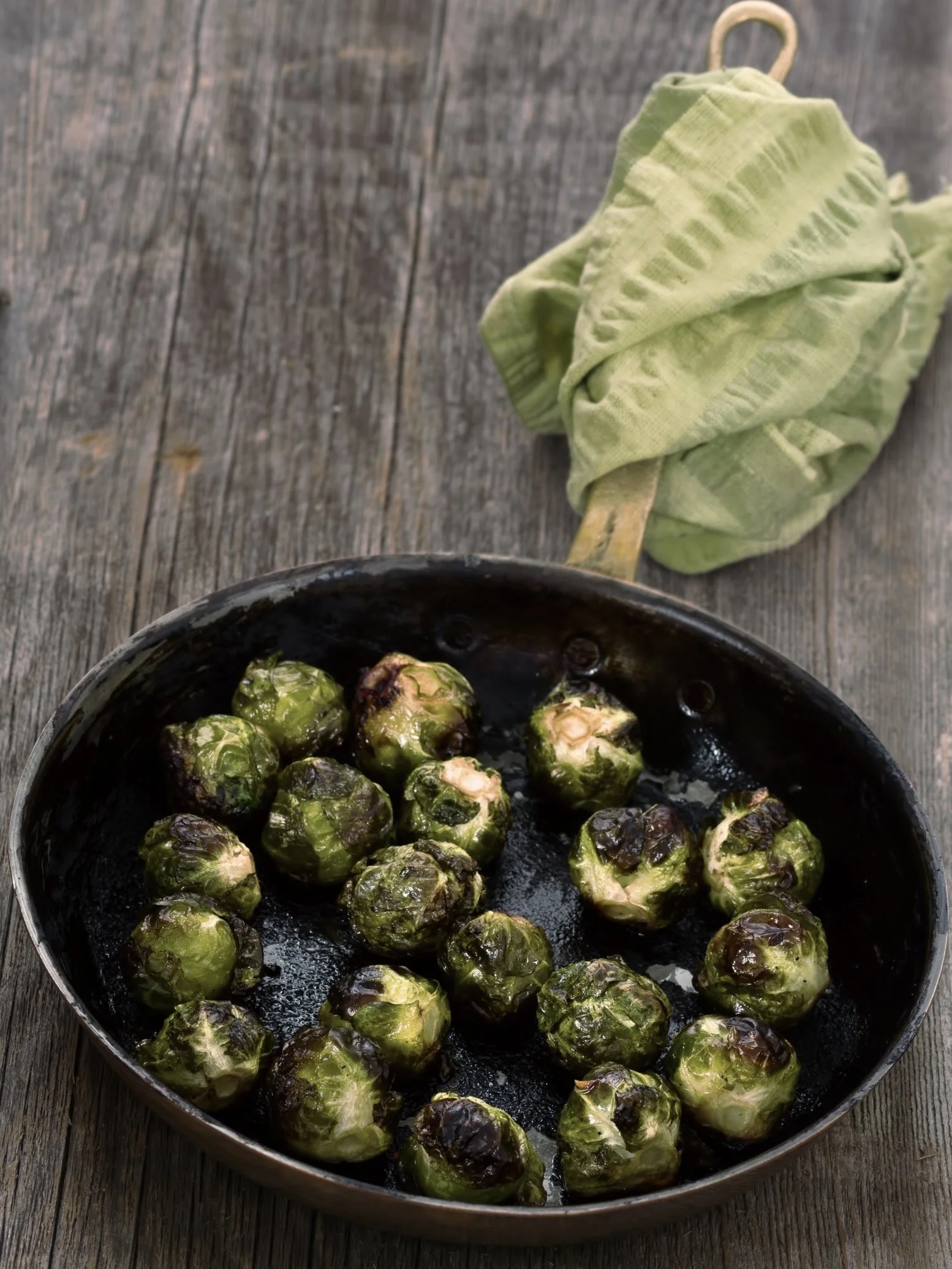 Roasted Brussels Sprouts with Cider Syrup, Andouille Sausage, and Ricotta Salata