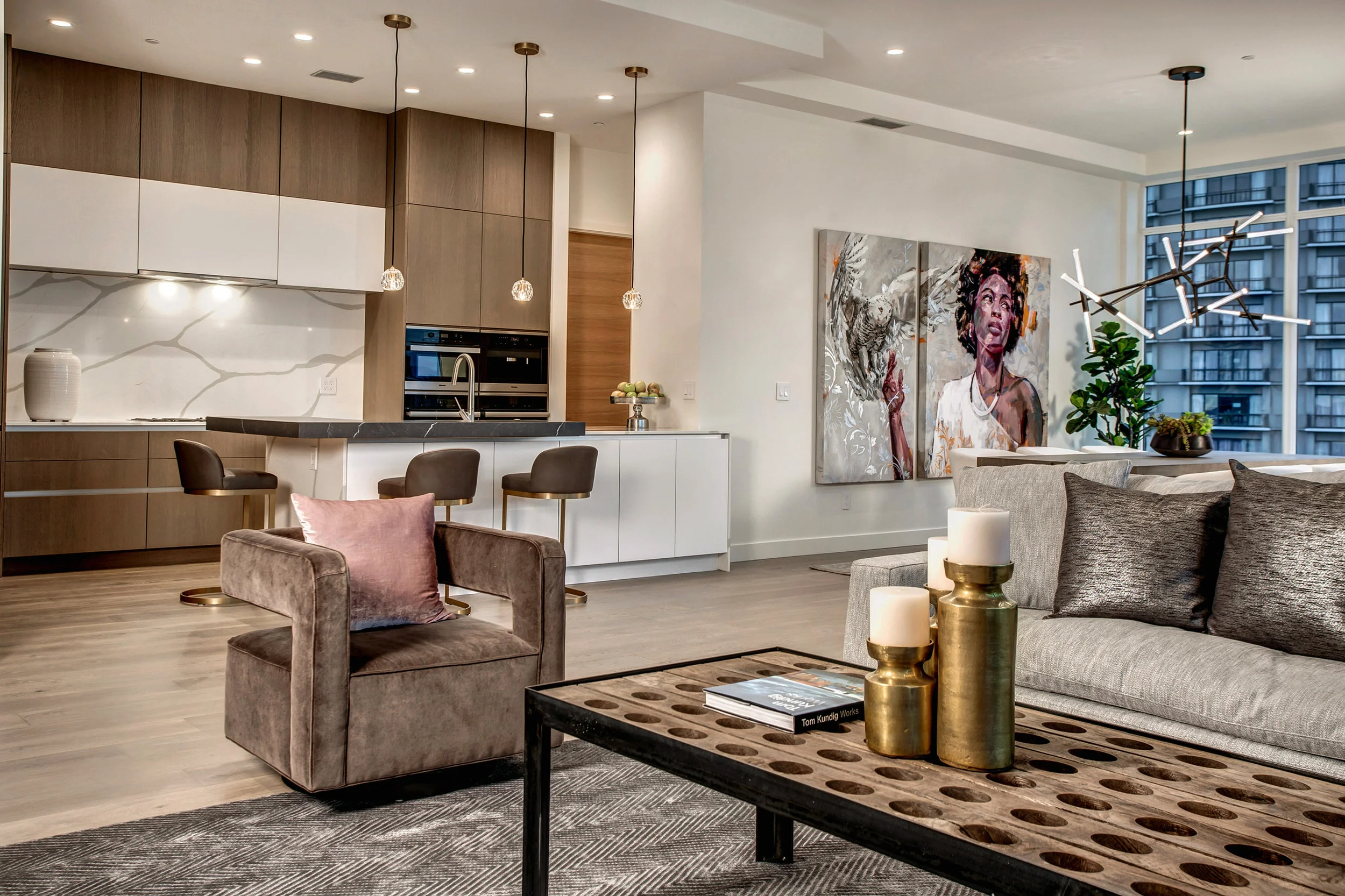 View of the open living, dining, and kitchen area. Modern contemporary design and details throughout.