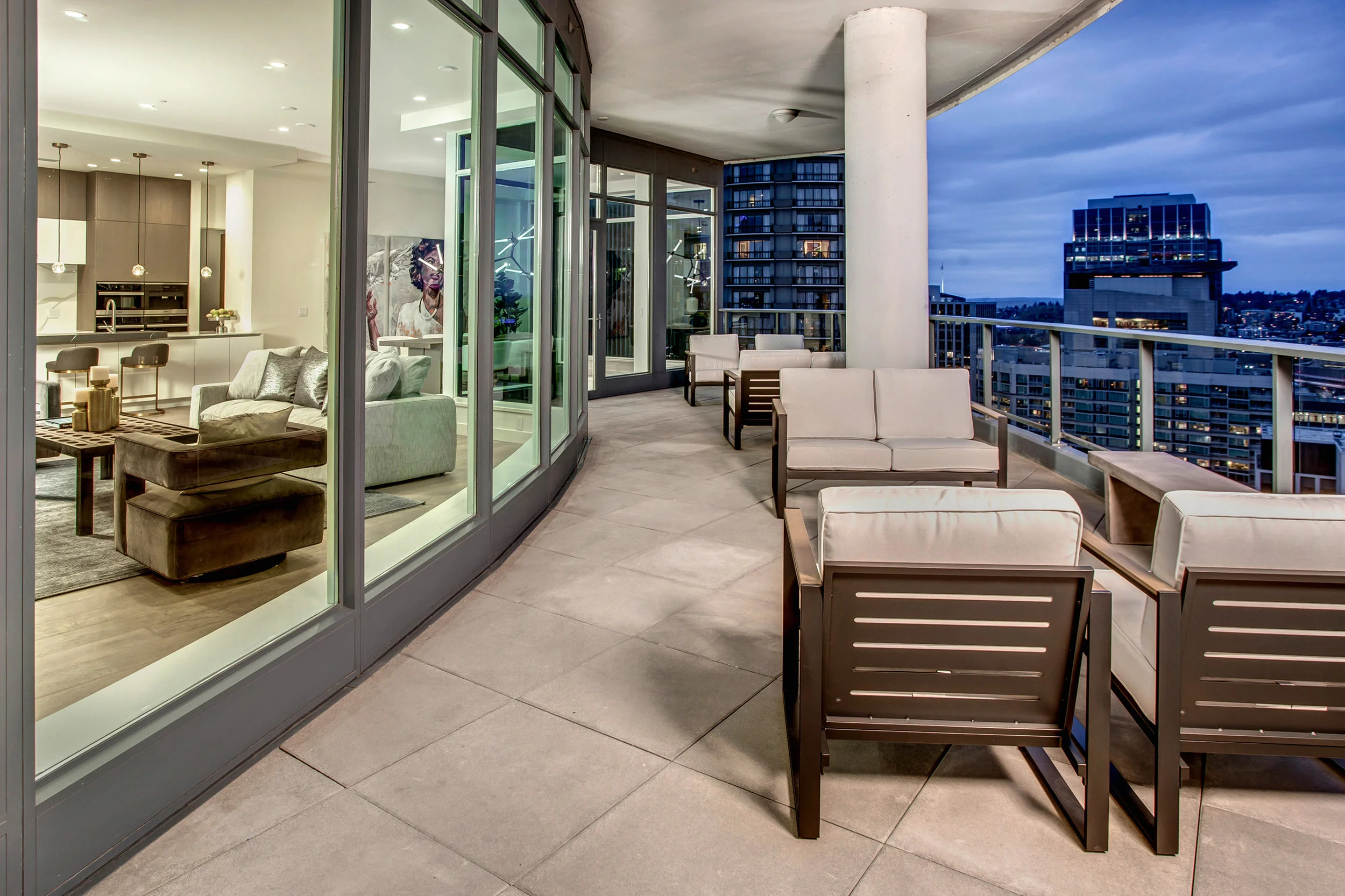 Expansive covered balcony with south and southeast facing views of the city’s historical district, Cascade mountains, and Puget Sound.