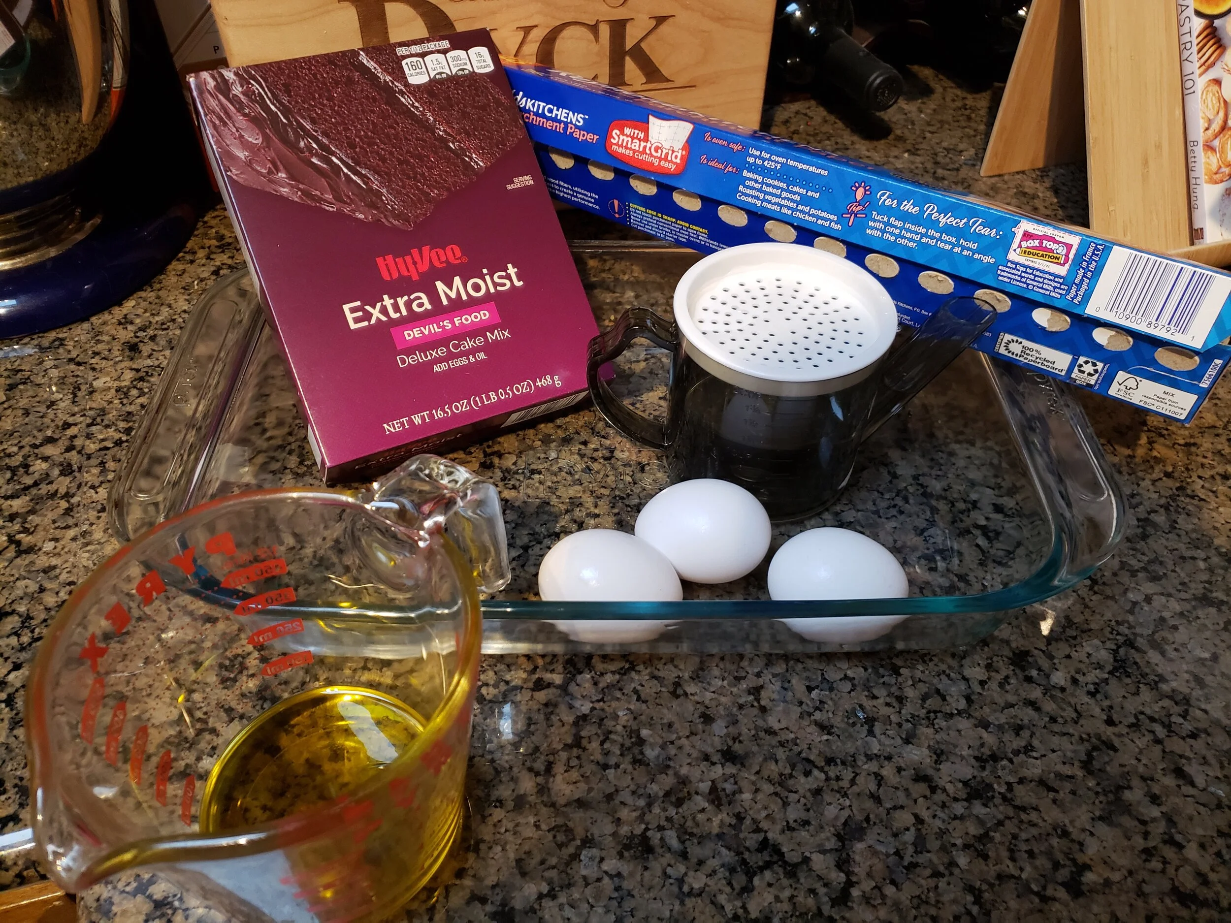Box cake mix and the necessary ingredients for it.