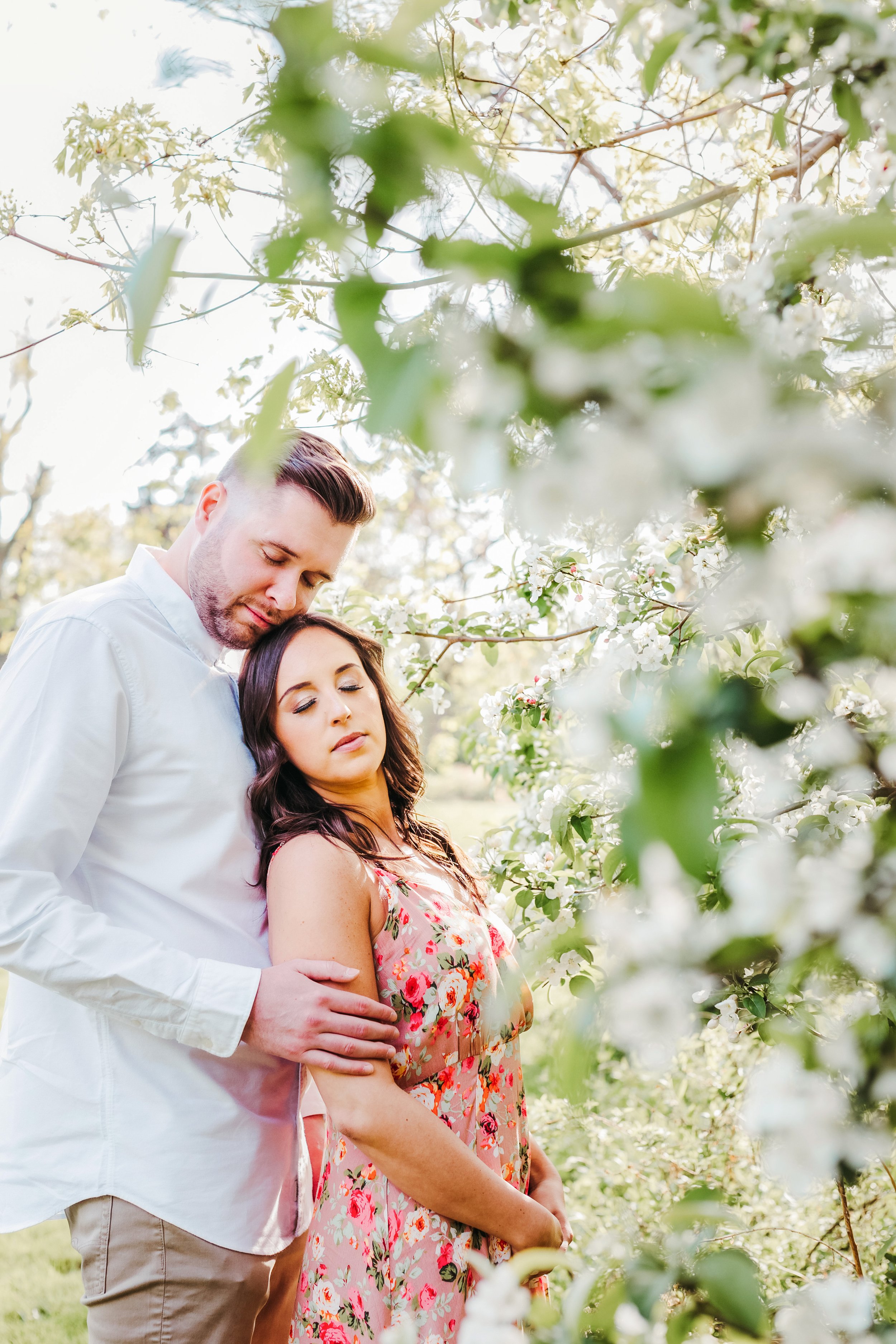 Spring engagement shoot with flowers on trees