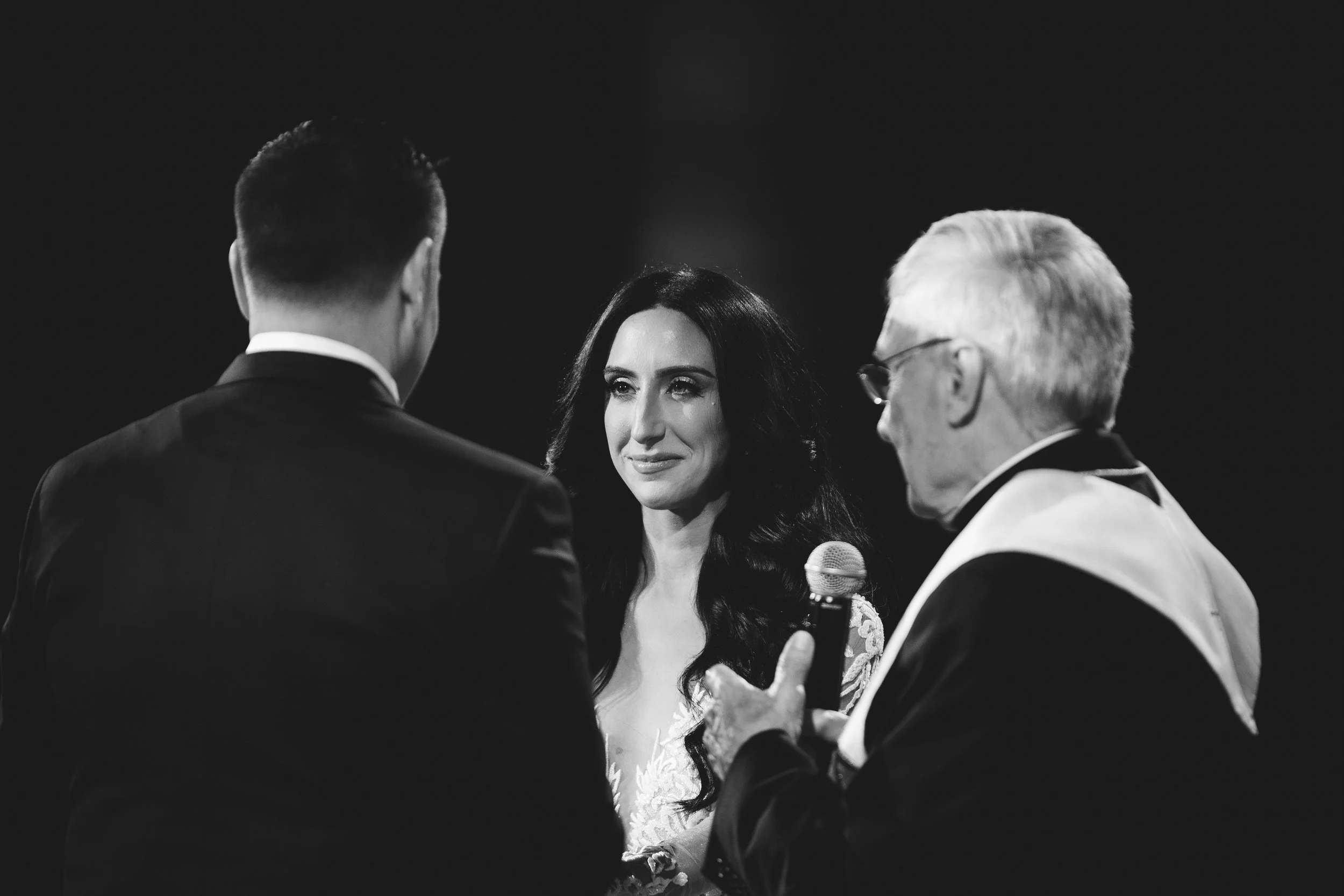 Bride and groom saying their vows at the altar