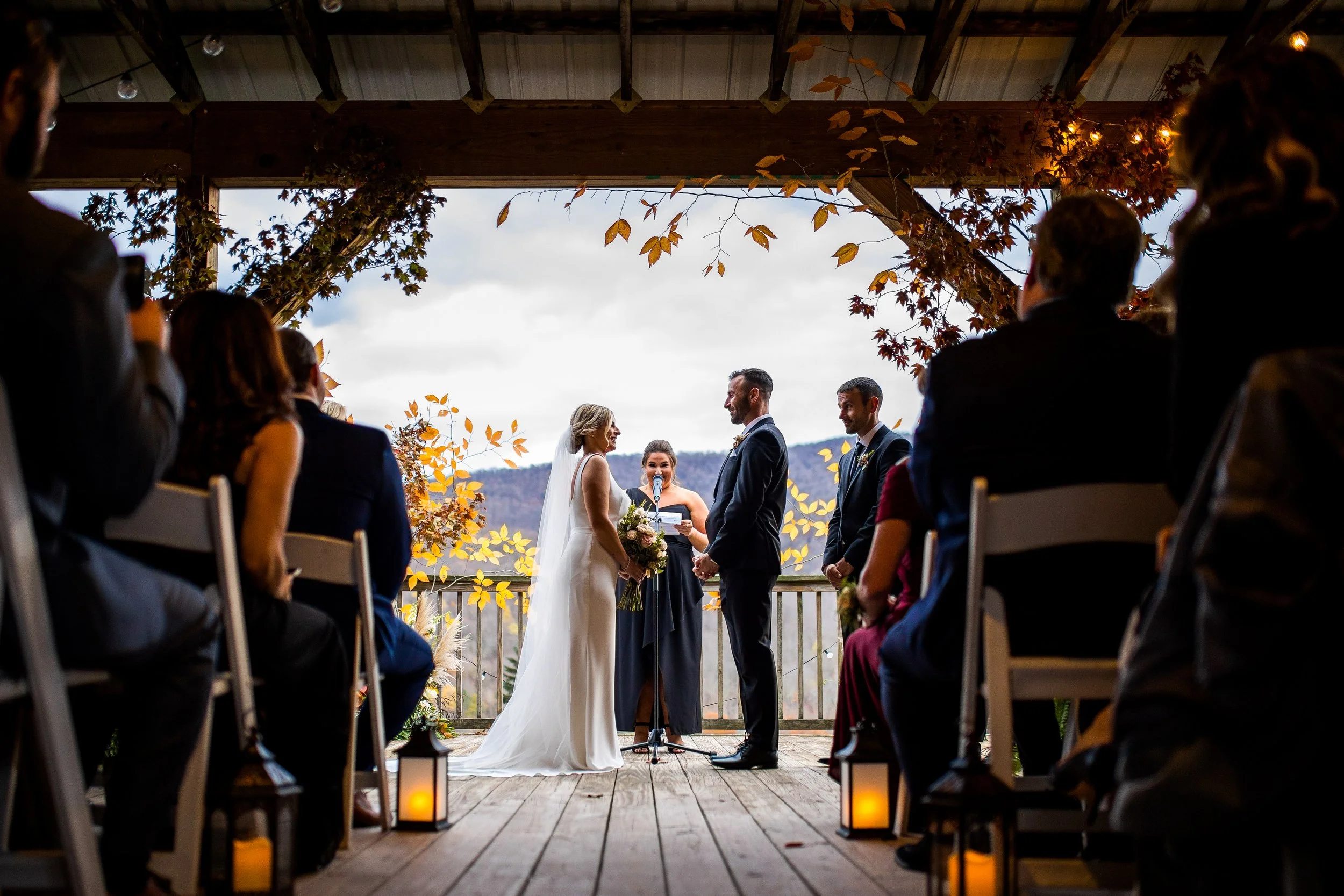 Bride and groom at the altar during their rustic barn wedding ceremony