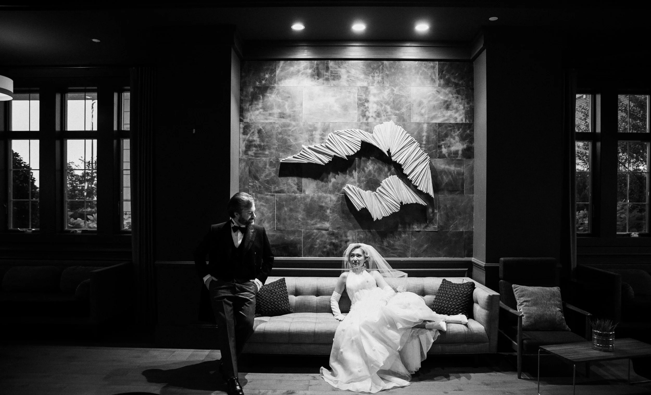 Bride and groom sitting on a couch