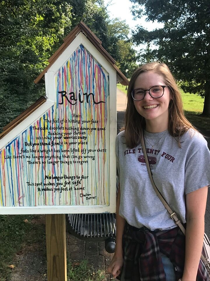 Numerous local youth collaborated to design, build and decorate Little Libraries on the Breezeway Restorative Trail near Gateway Island. This is Chelsea Butner with her poem “Rain.”  Photo courtesy Cultural Arts Murfreesboro. 