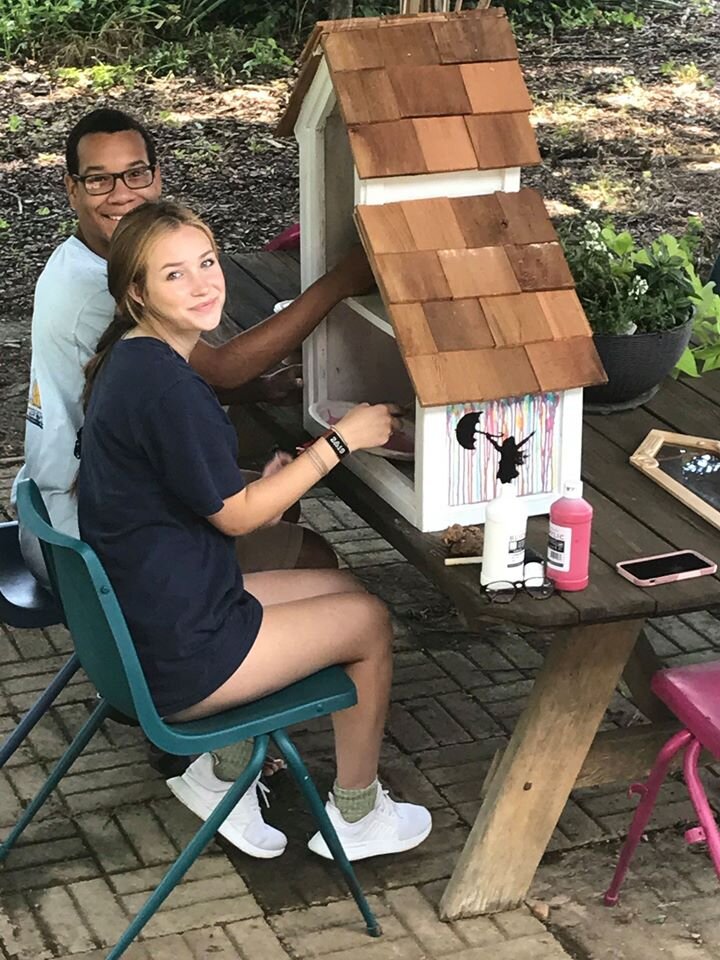  Numerous local youth collaborated to design, build and decorate Little Libraries on the Breezeway Restorative Trail near Gateway Island. Pictured here: Sarah Oppmann and Aubrey Caster. Photo courtesy Cultural Arts Murfreesboro. 