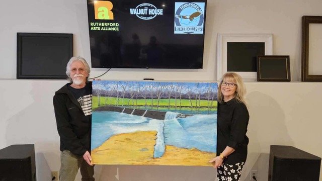  Larry Pinkerton and Pam Mack with Larry’s painting 