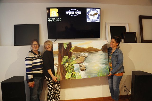  Susan Gulley, Pam Mack, and Lisa Browning with Lisa’s painting. 