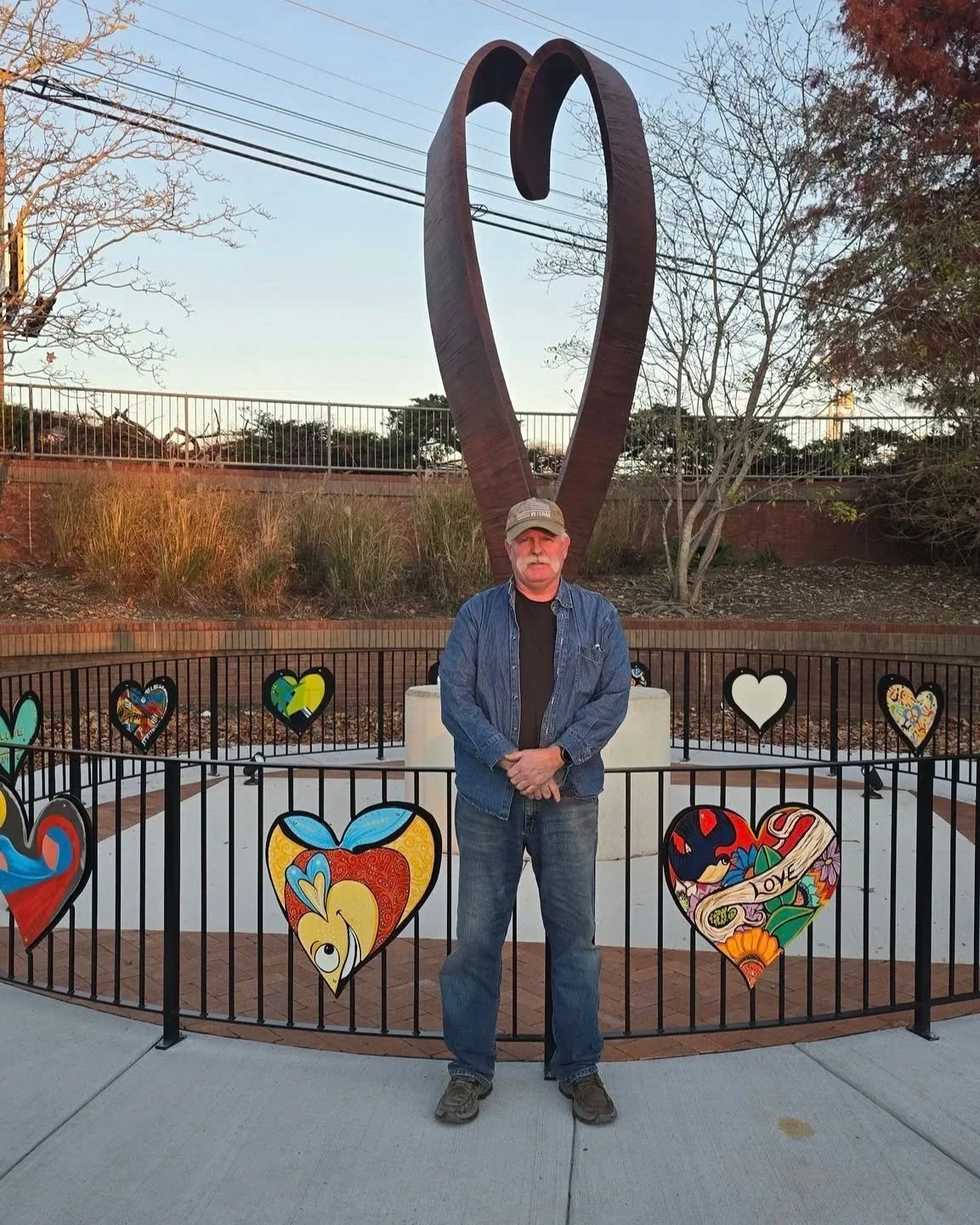  Blacksmith Joe Brown made the fence and attached the hearts, each one made by a different local artist. 