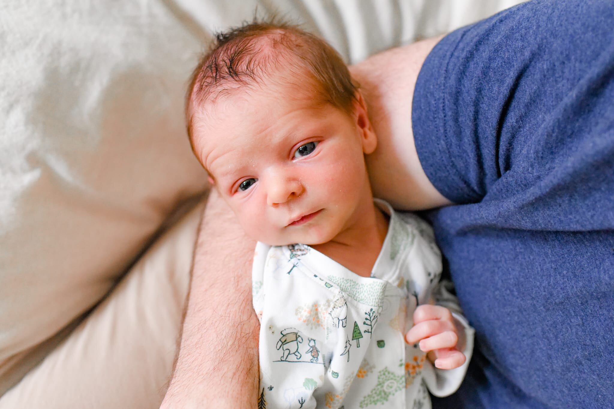 Rockville Maryland Newborn Photographer - baby looking up at camera