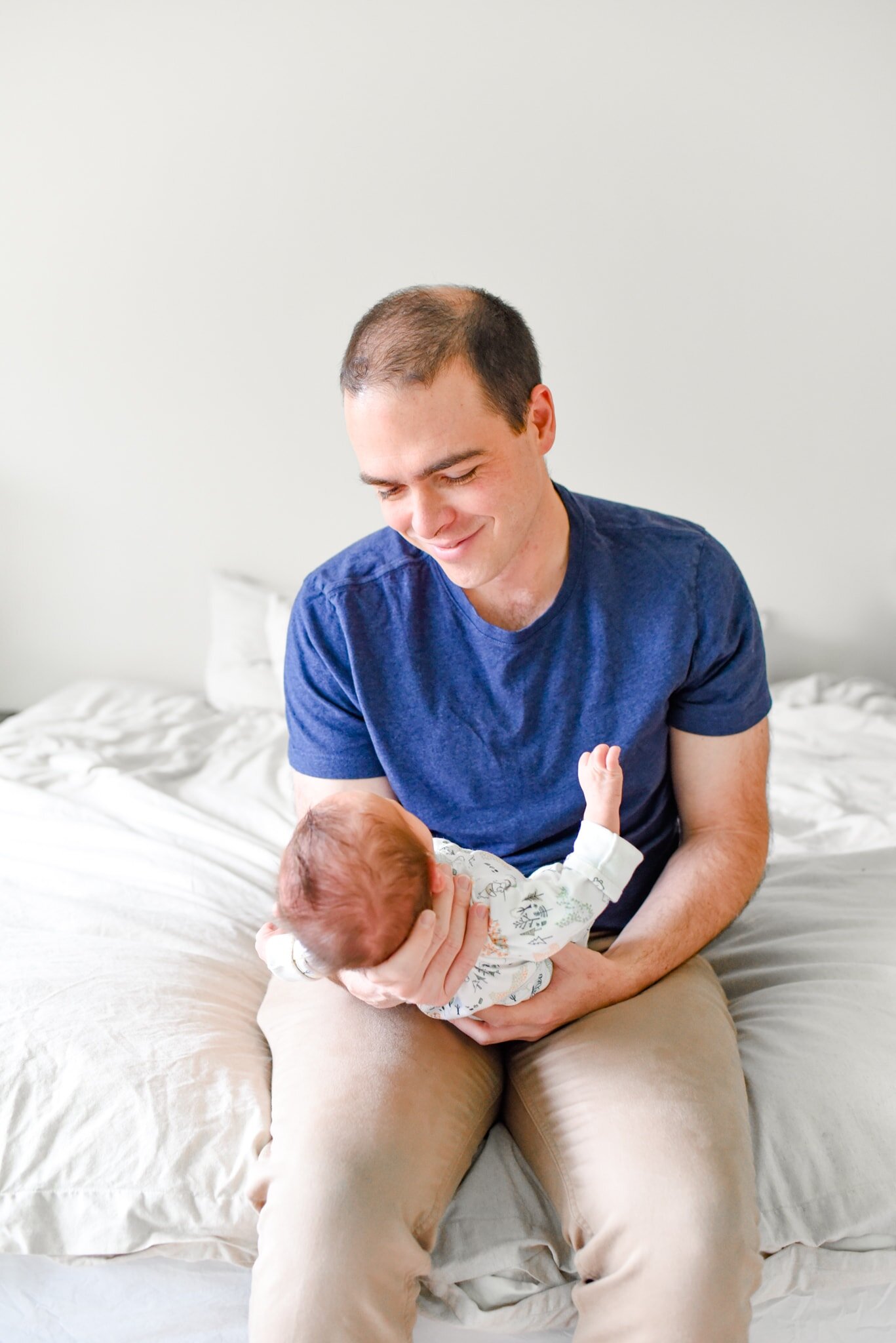 Rockville Maryland Newborn Photographer - dad cradling baby