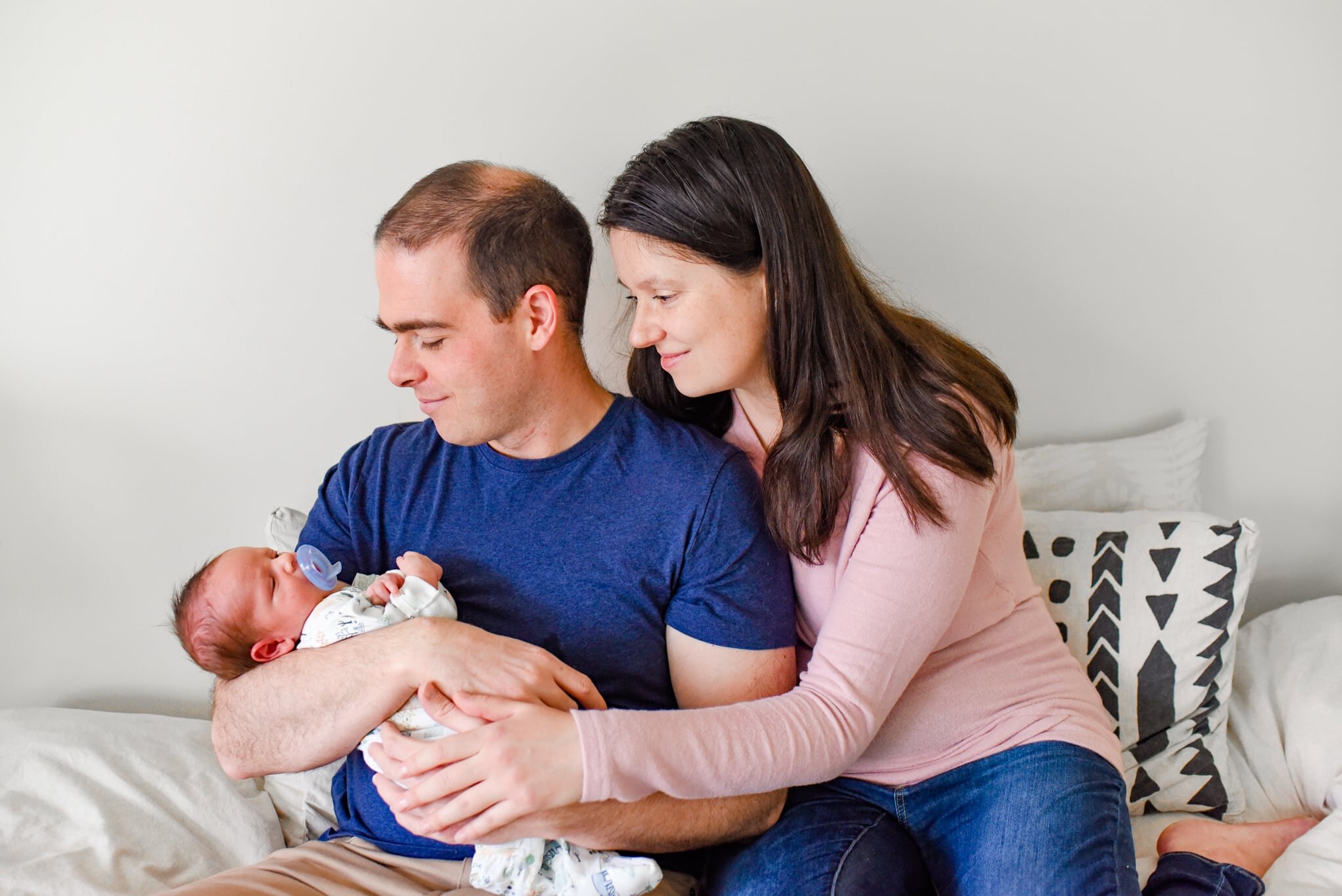 Rockville Maryland Newborn Photographer - mom and dad cradling baby