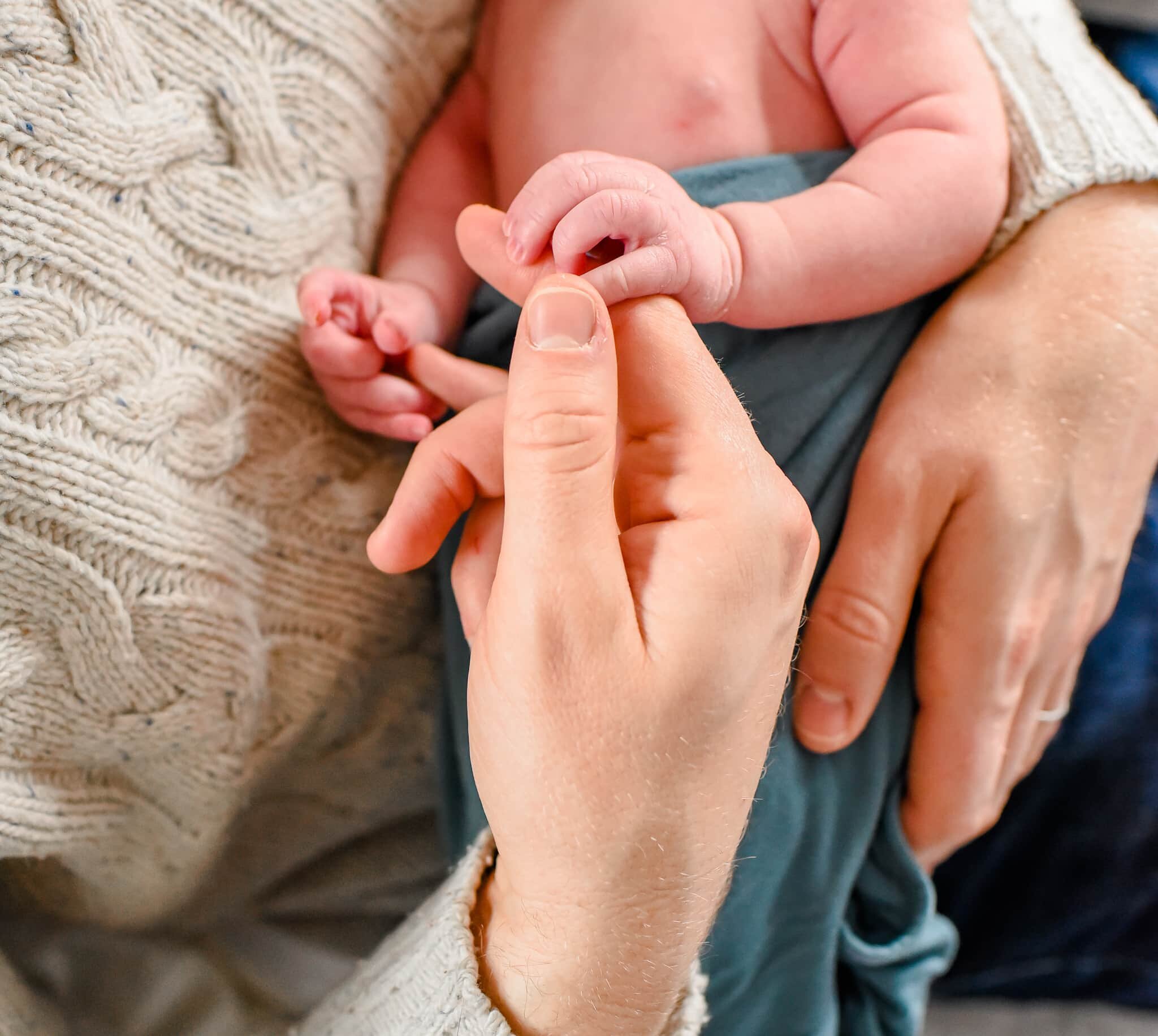 Silver Spring Maryland Newborn Photoshoot - baby's finger curled on dad's hand