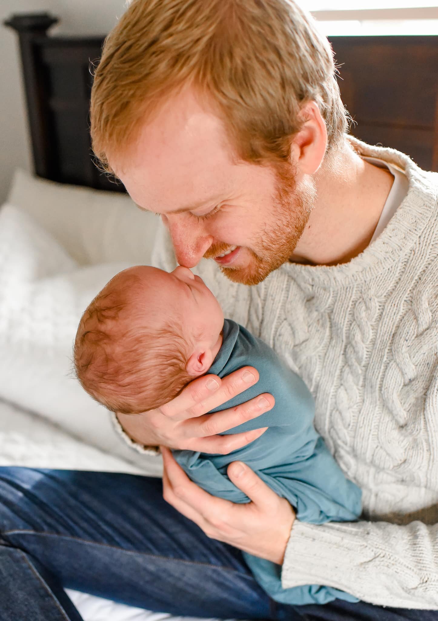 Silver Spring Maryland Newborn Photoshoot - dad cradling baby