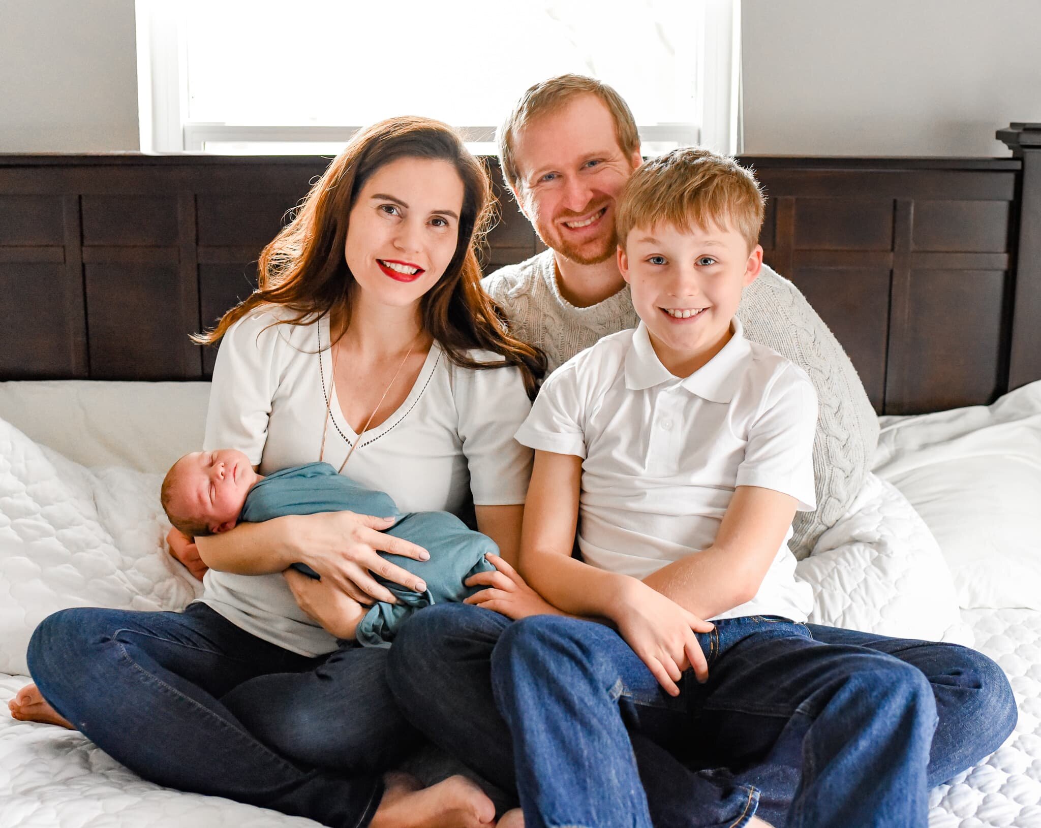 Silver Spring Maryland Newborn Photoshoot - family smiling at camera