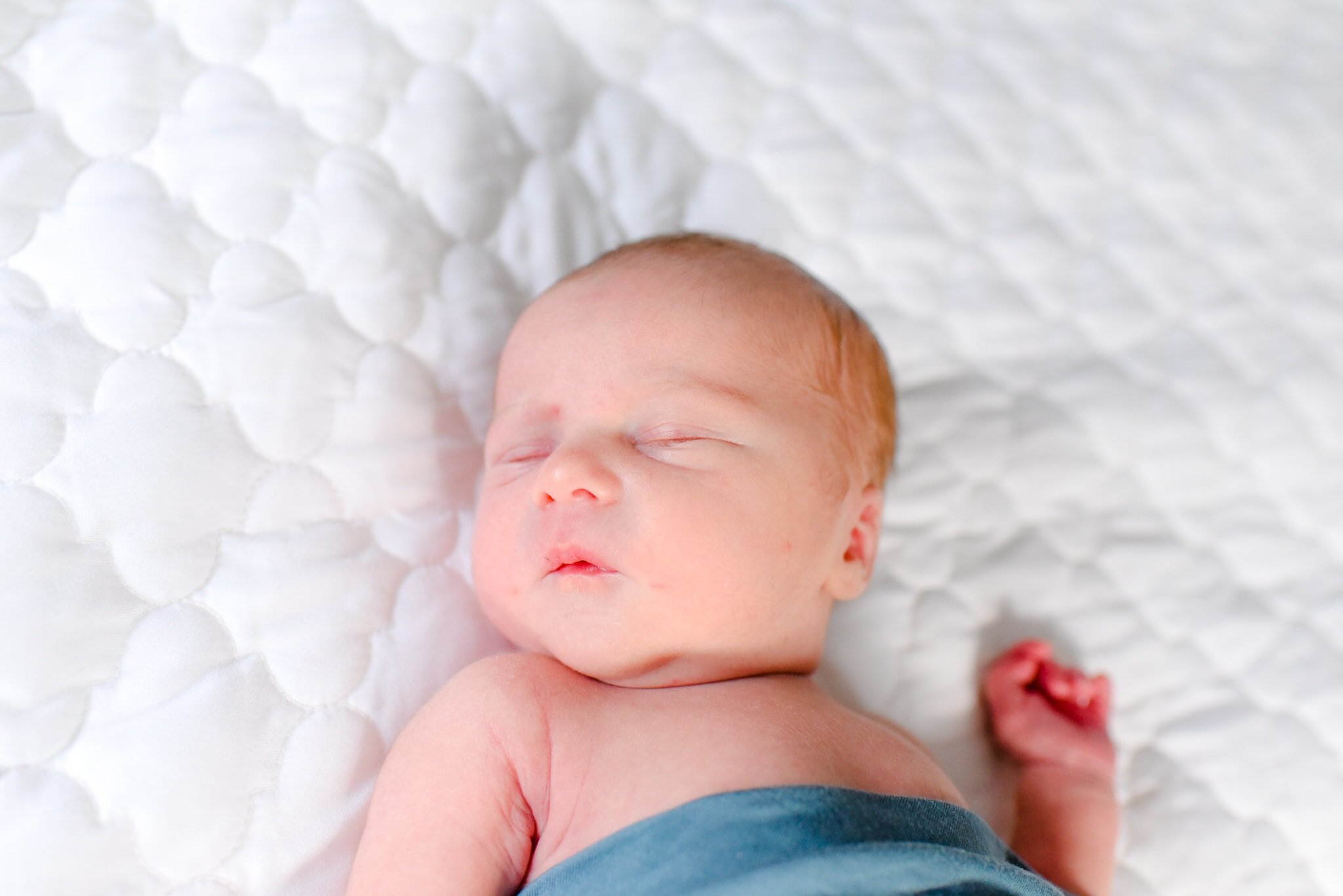 Silver Spring Maryland Newborn Photoshoot - baby sleeping on bed